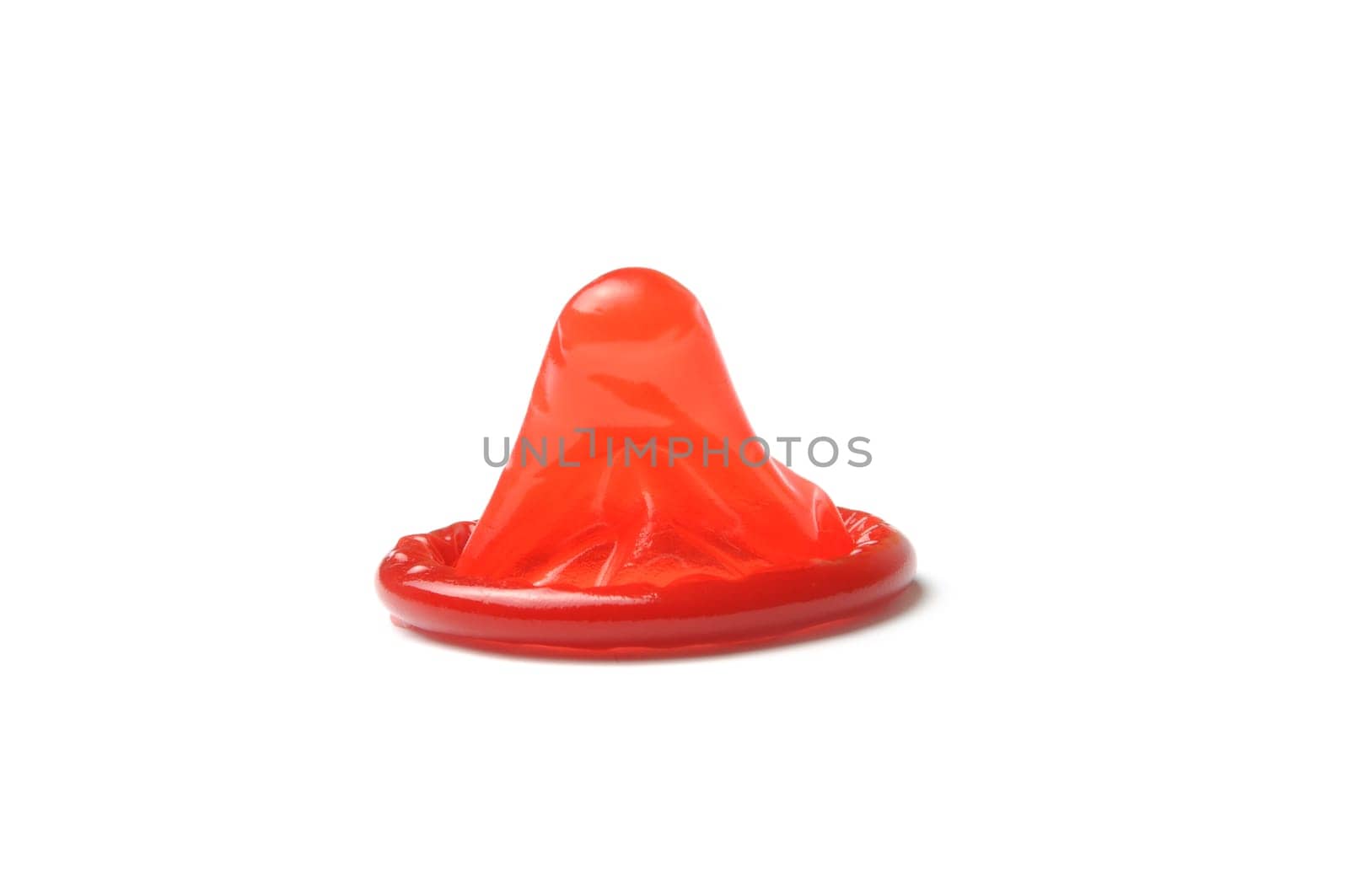 macro of red condom isolated on white background