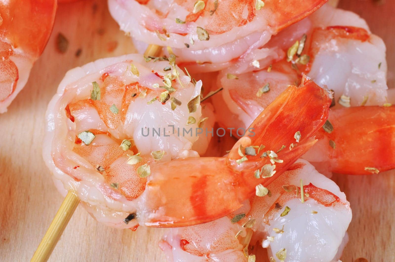 Shrimps,lemon and basil on isolated board on white background