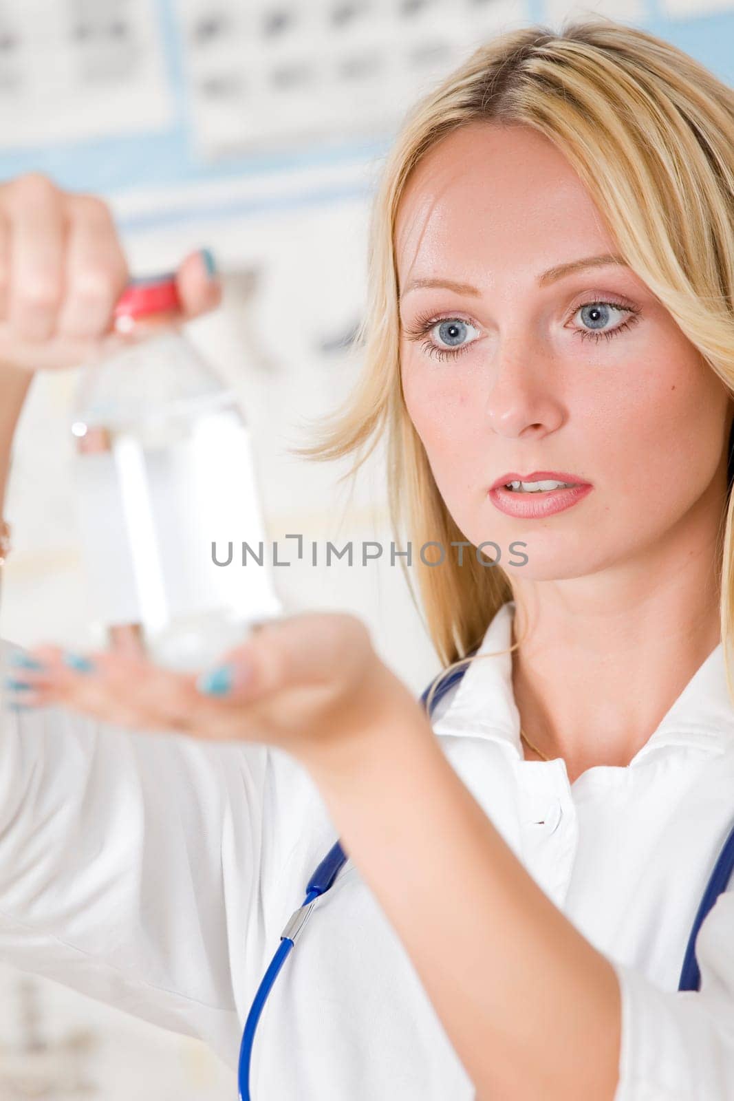 young woman doctor with medicine bottle