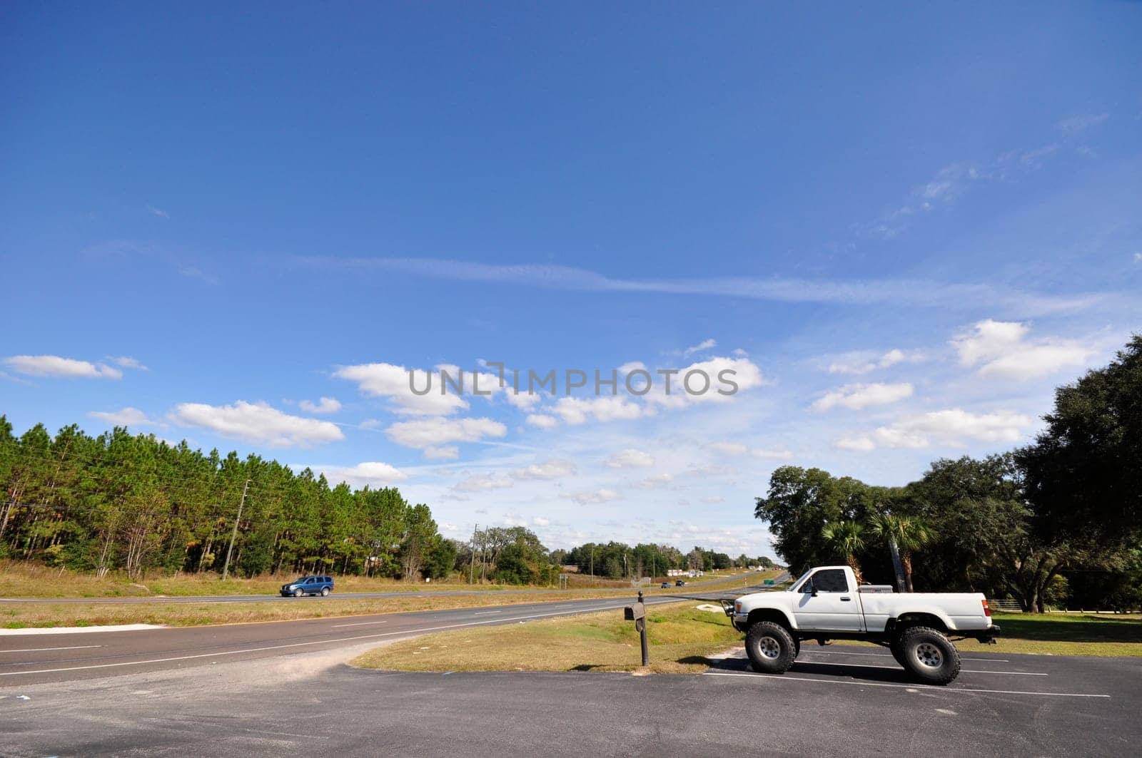 countryside road with a single truck at the side