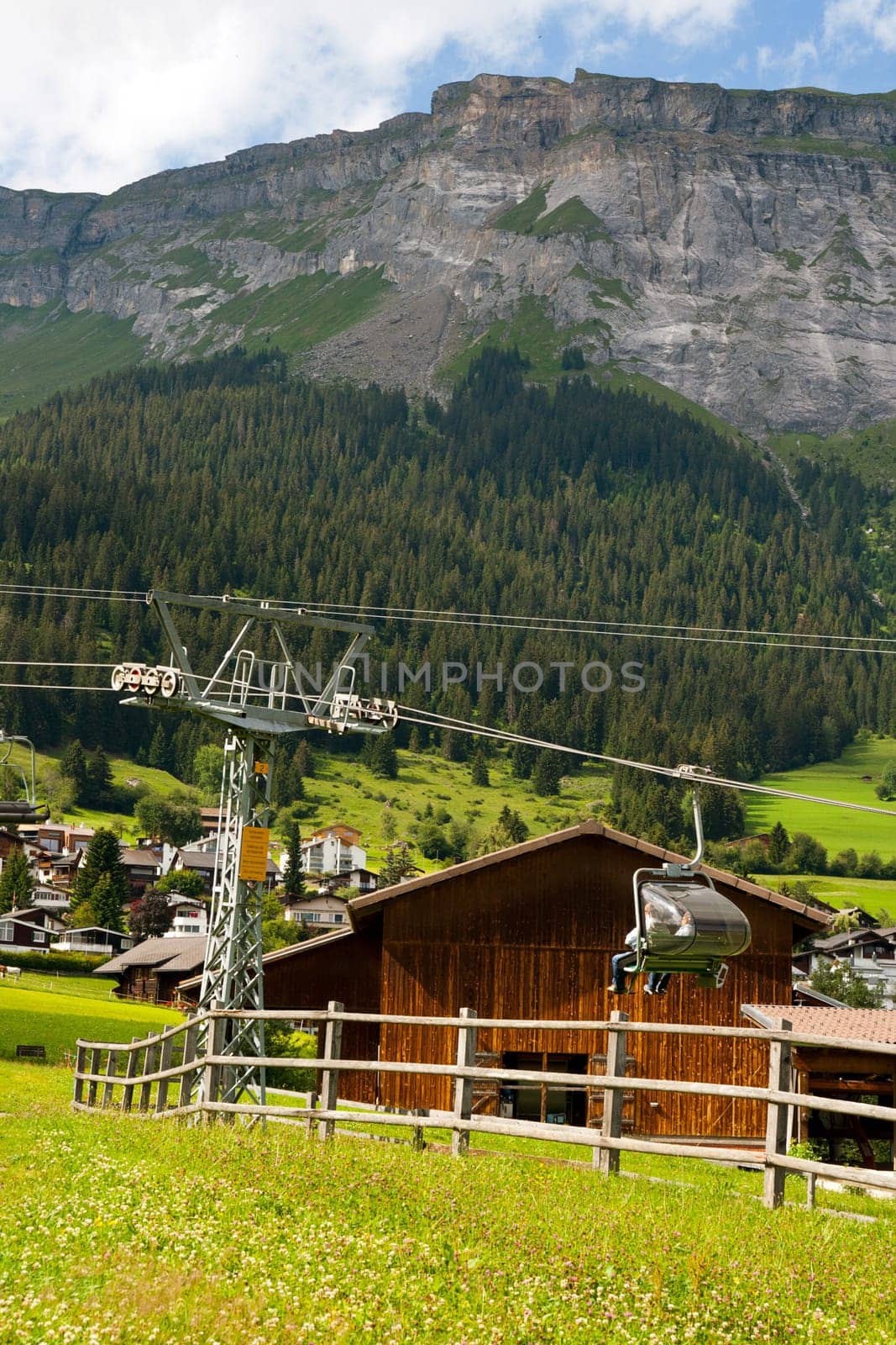 Chairlift in front of mountain panorama