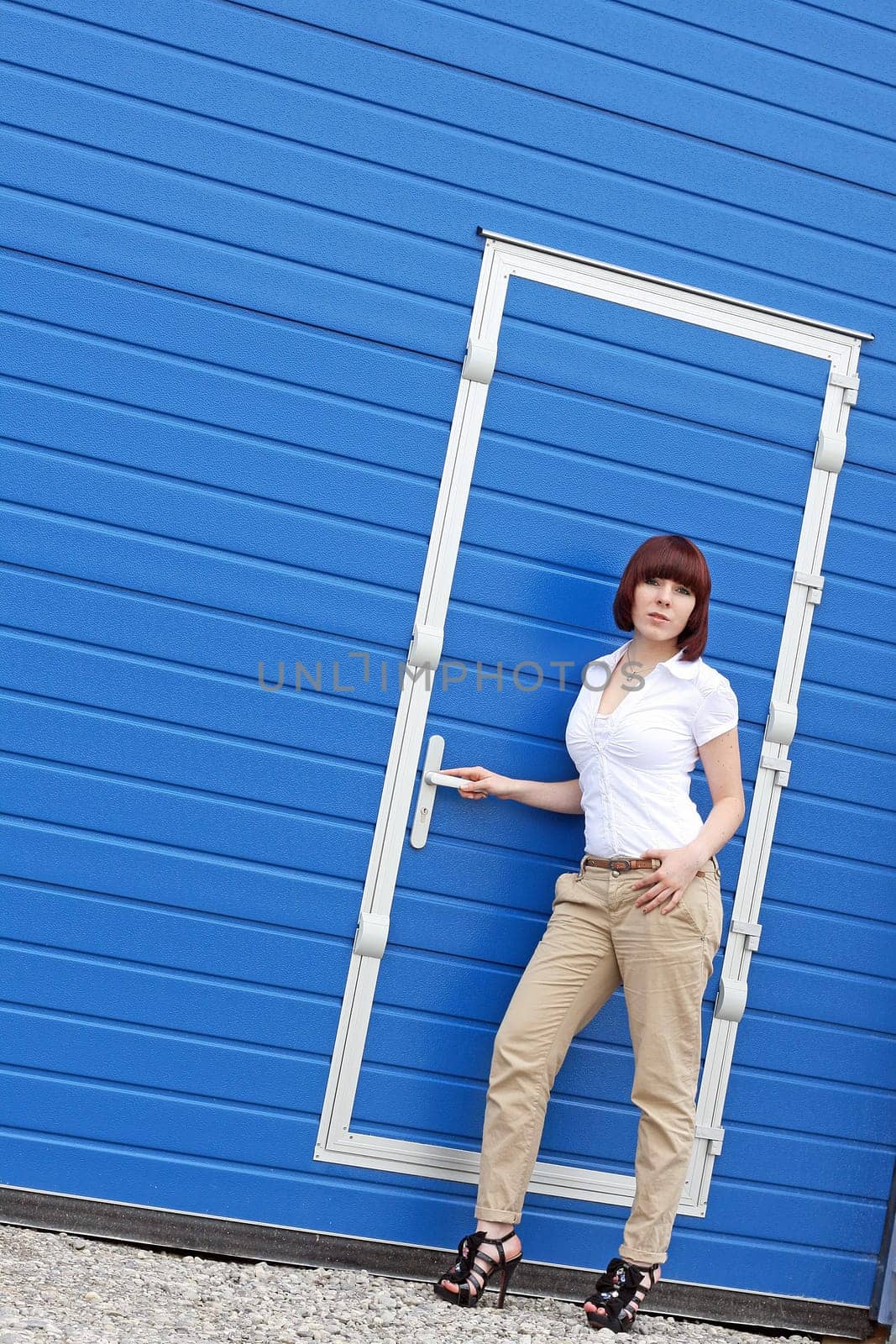 In front of the blue door