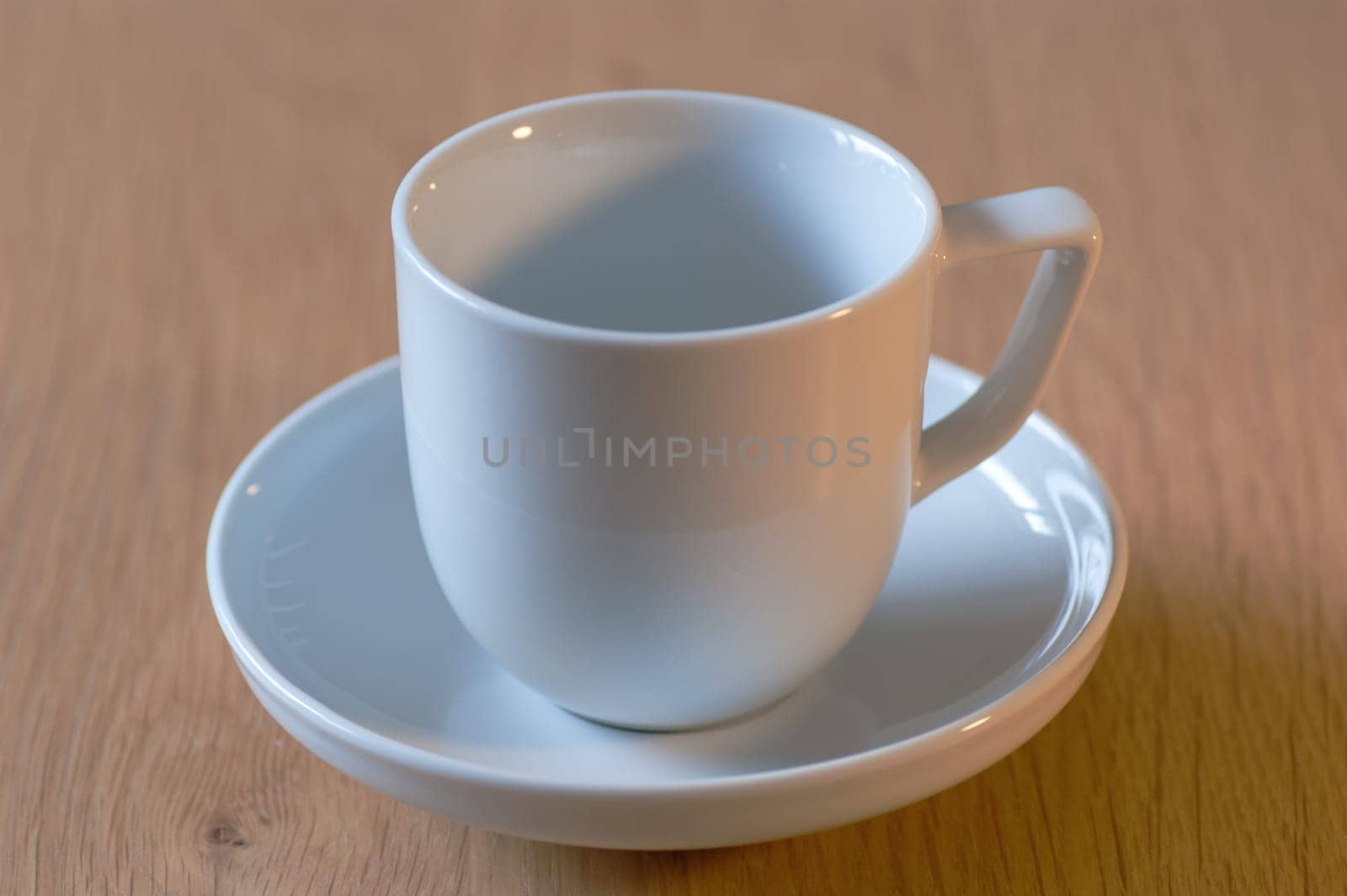Single white cup and saucer