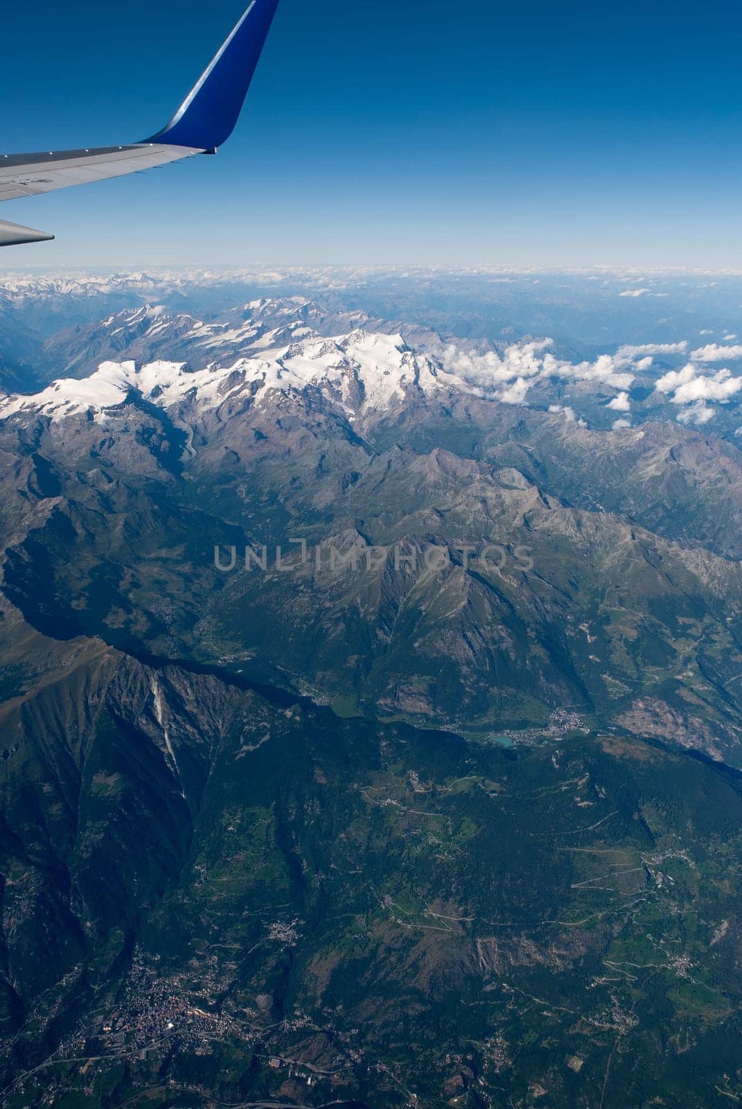 alps between switzerland and italy seen from the plane