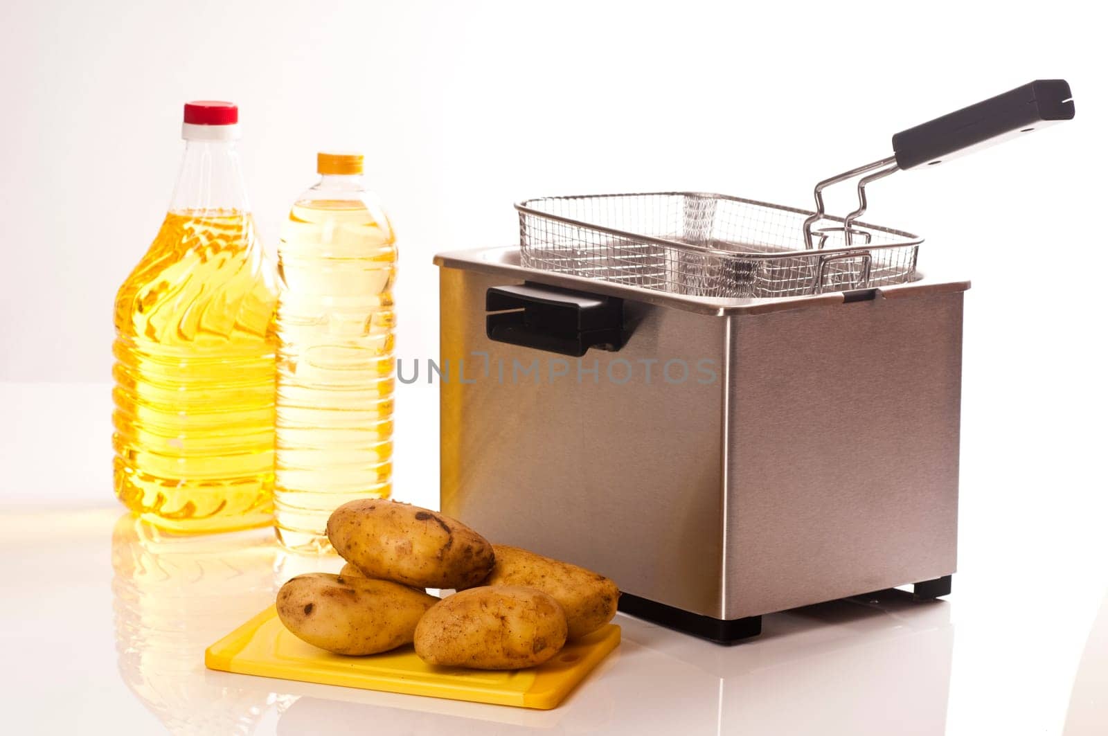 Stainless steel fryer on white background