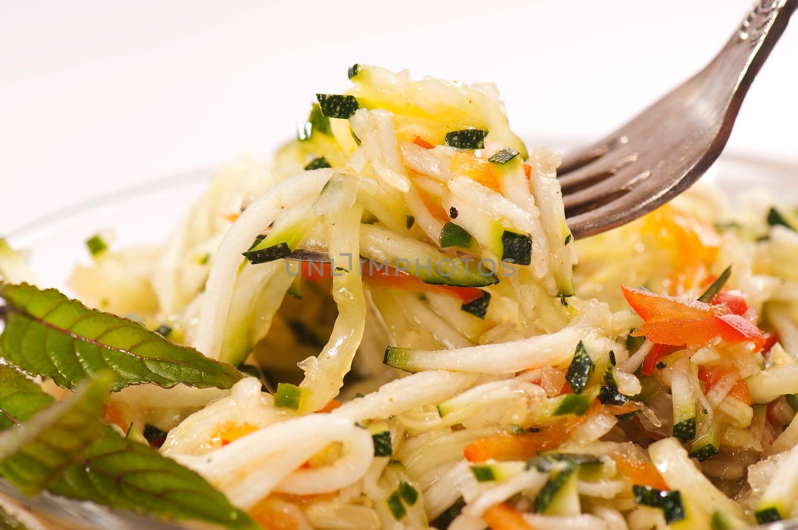 Zucchini salad in glass bowl
