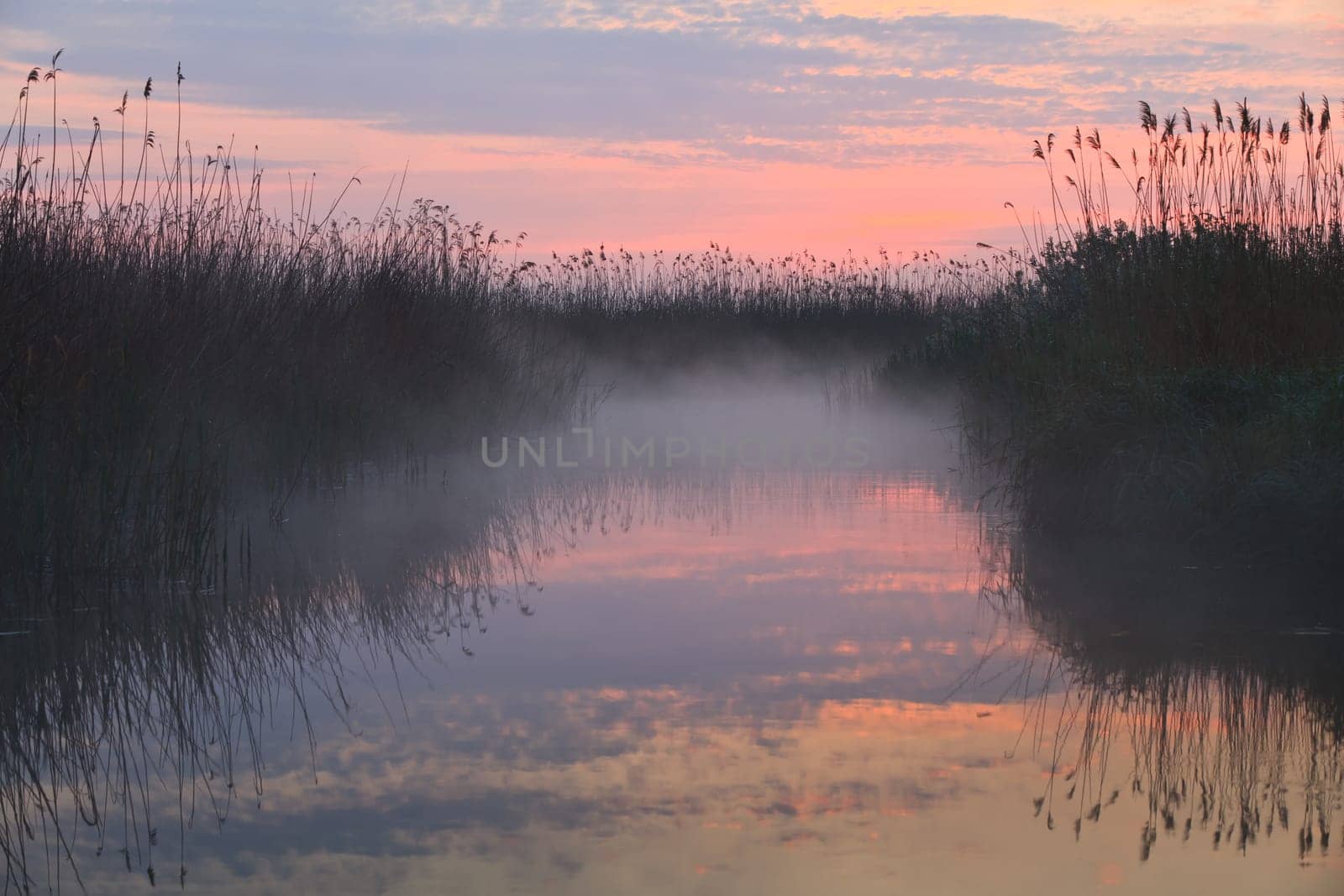 reflection of clouds on the lake at sunrise