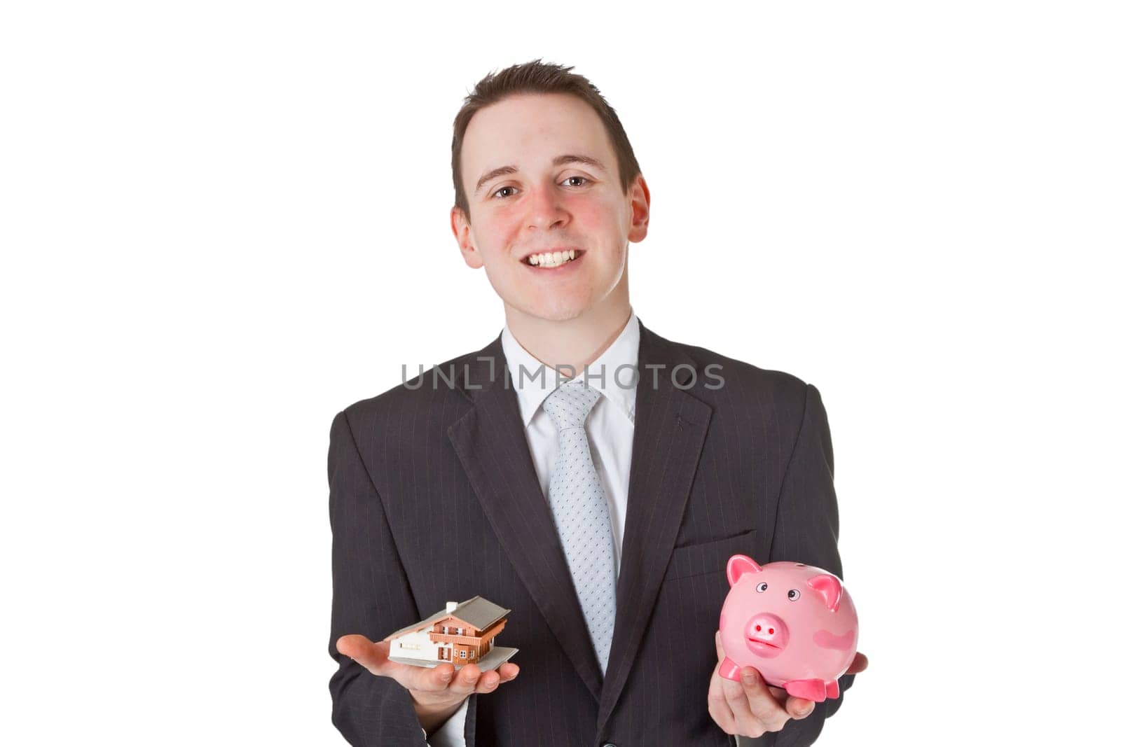 Friendly businessman presenting model house - isolated on white background