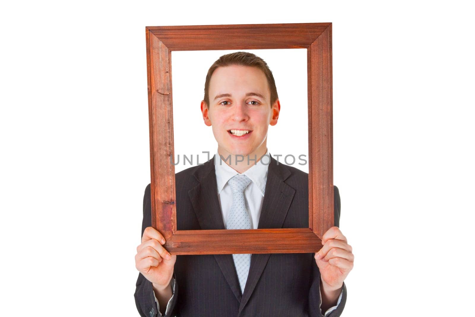 Friendly businessman with picture frame isolated on white background