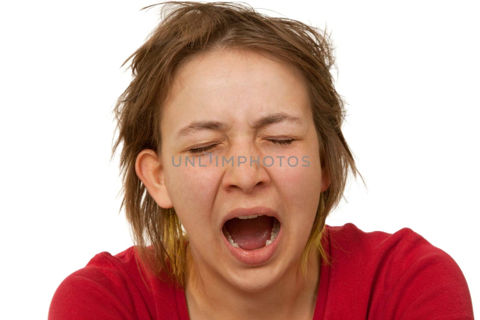 Young woman yawning - isolated on white background