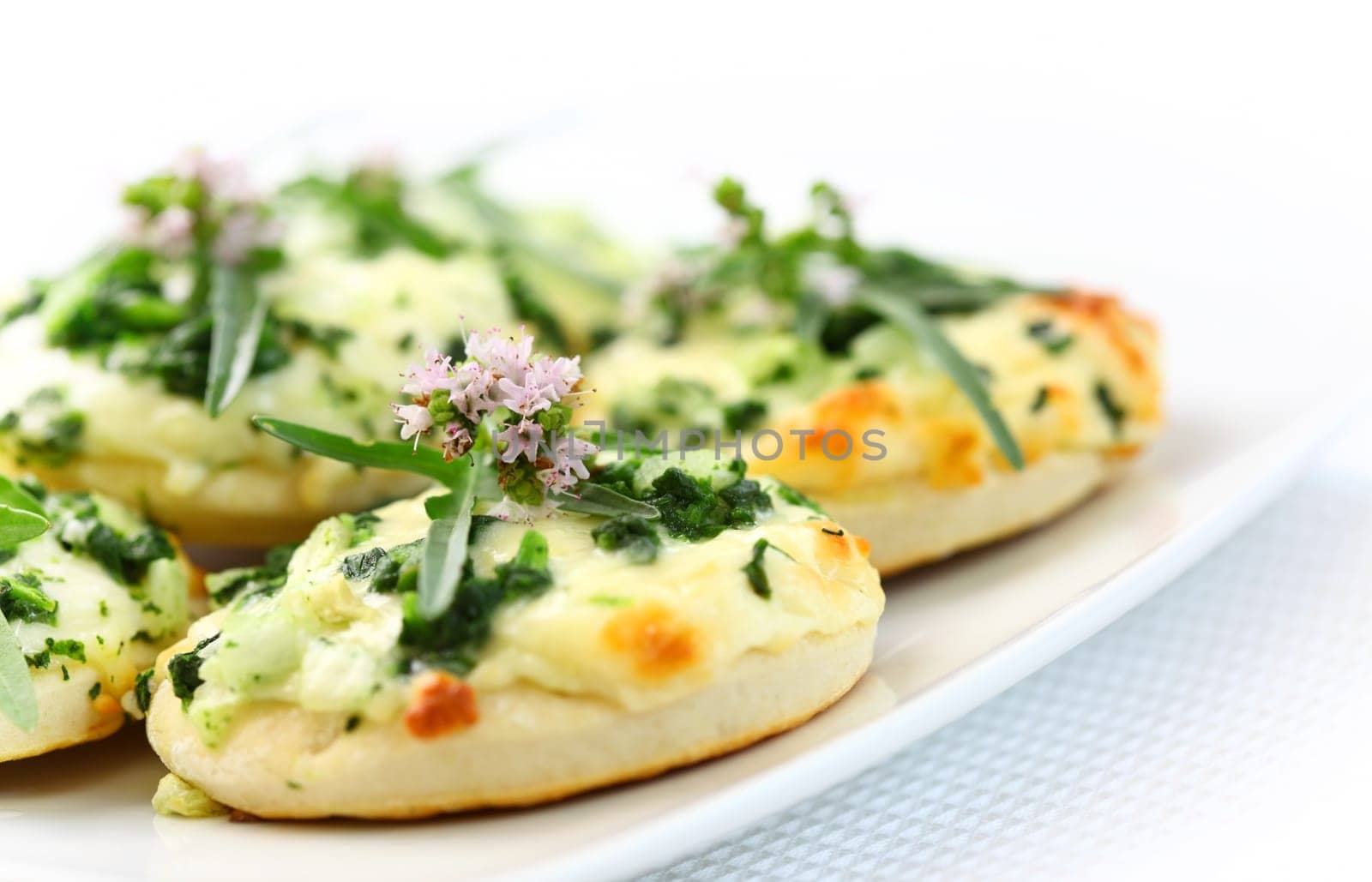 Small cakes with spinach and cheese as appetizer