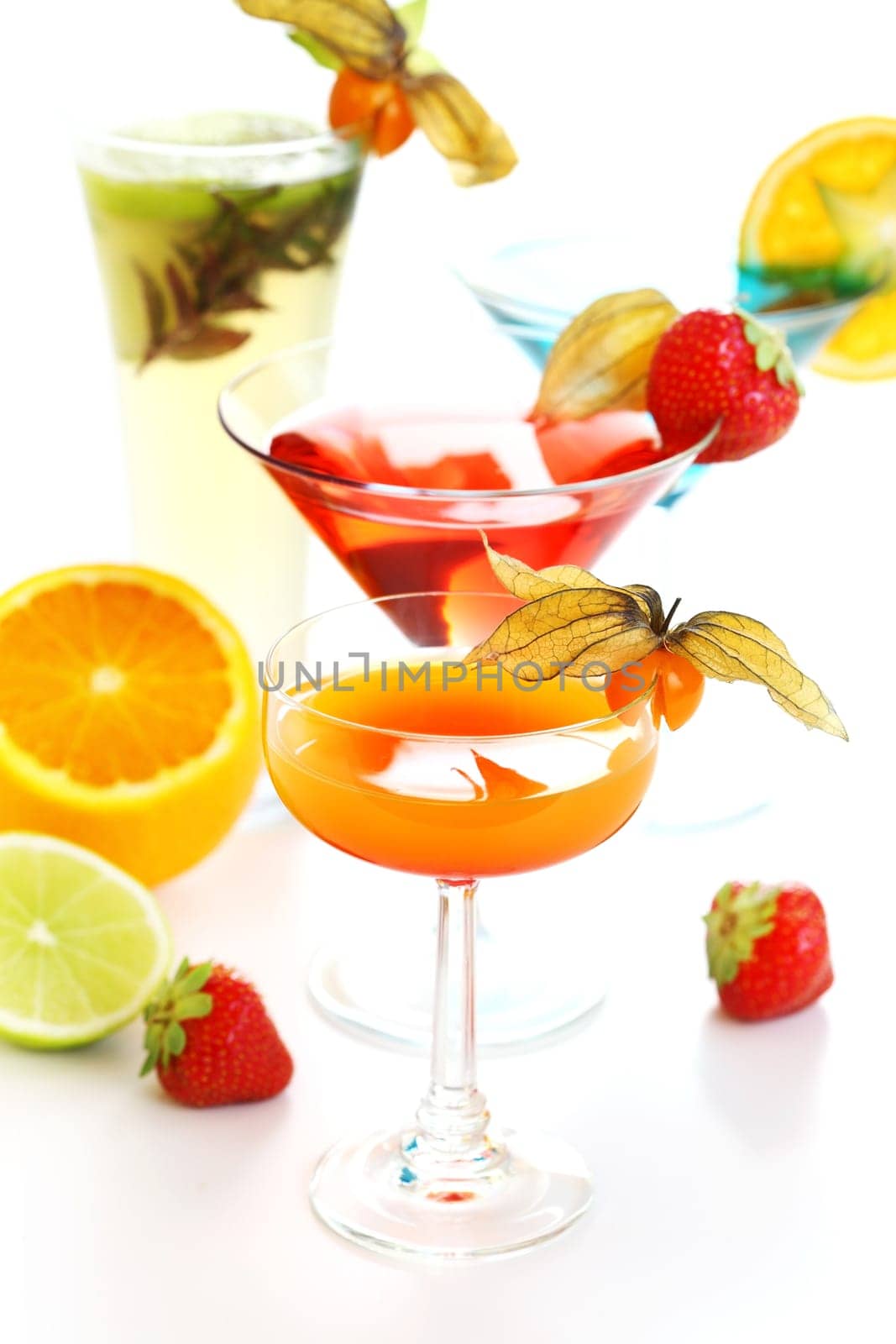 Different cocktails or longdrinks garnished with fruits