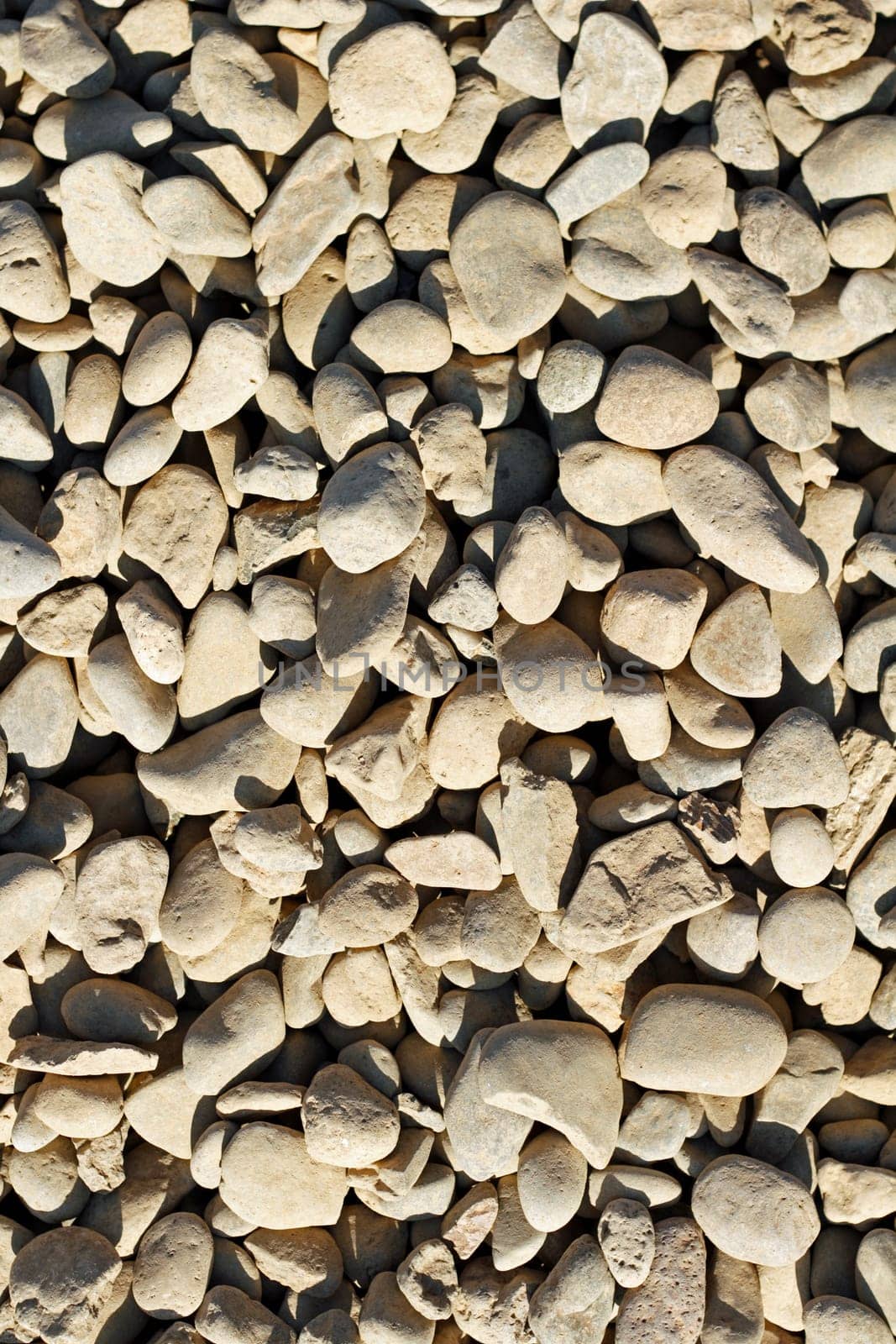 Background of tan gray rocks used for landscaping.