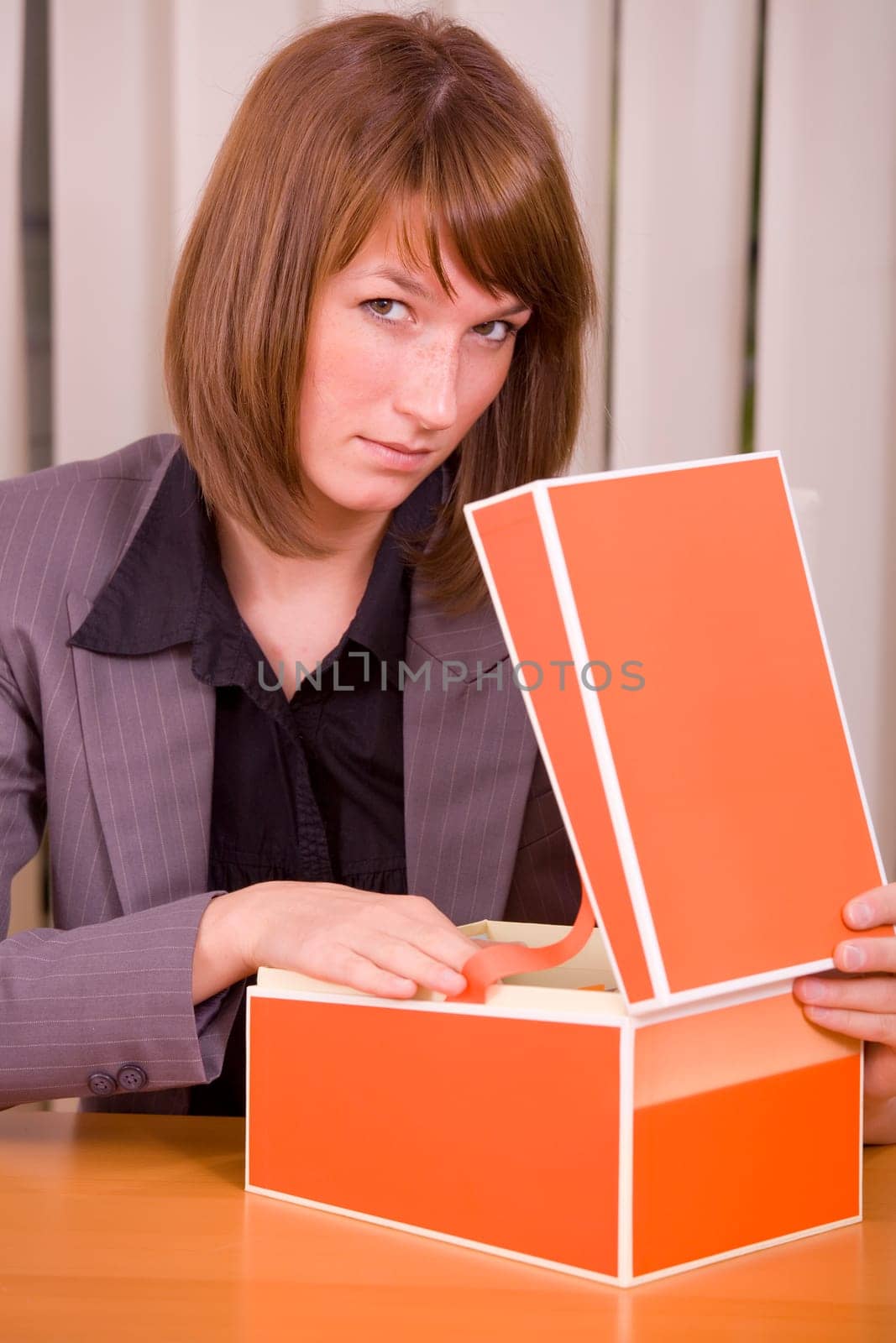 businesswoman with card index box by office work