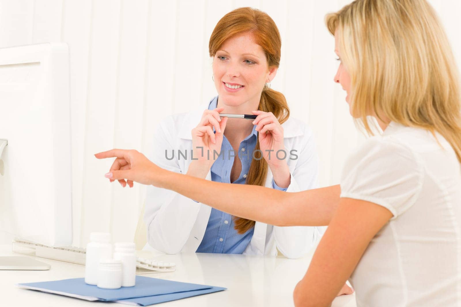 Female medical doctor consultation woman patient point at computer screen