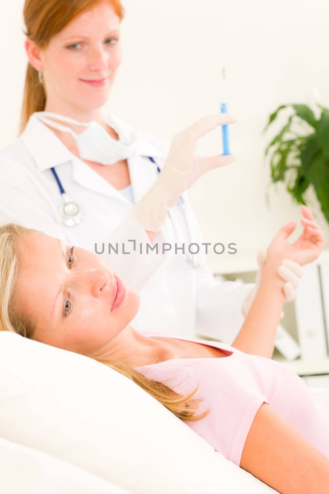 Female medical doctor apply injection woman patient