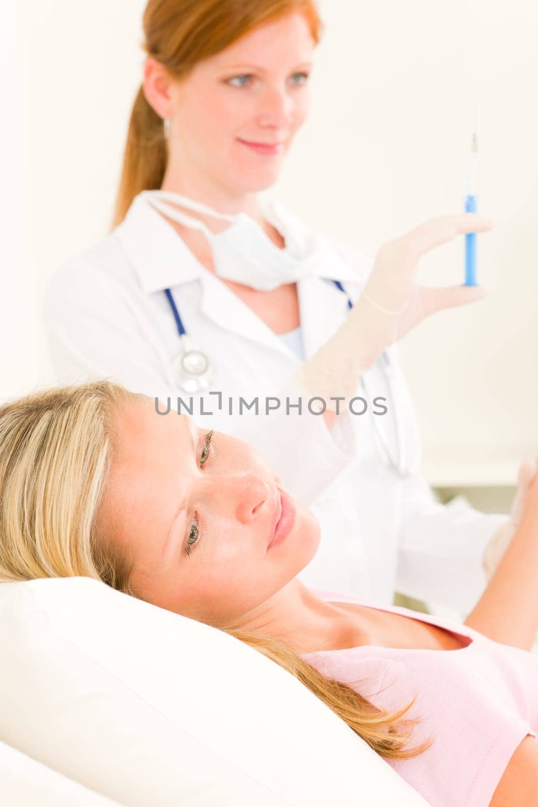 Female medical doctor apply injection woman patient