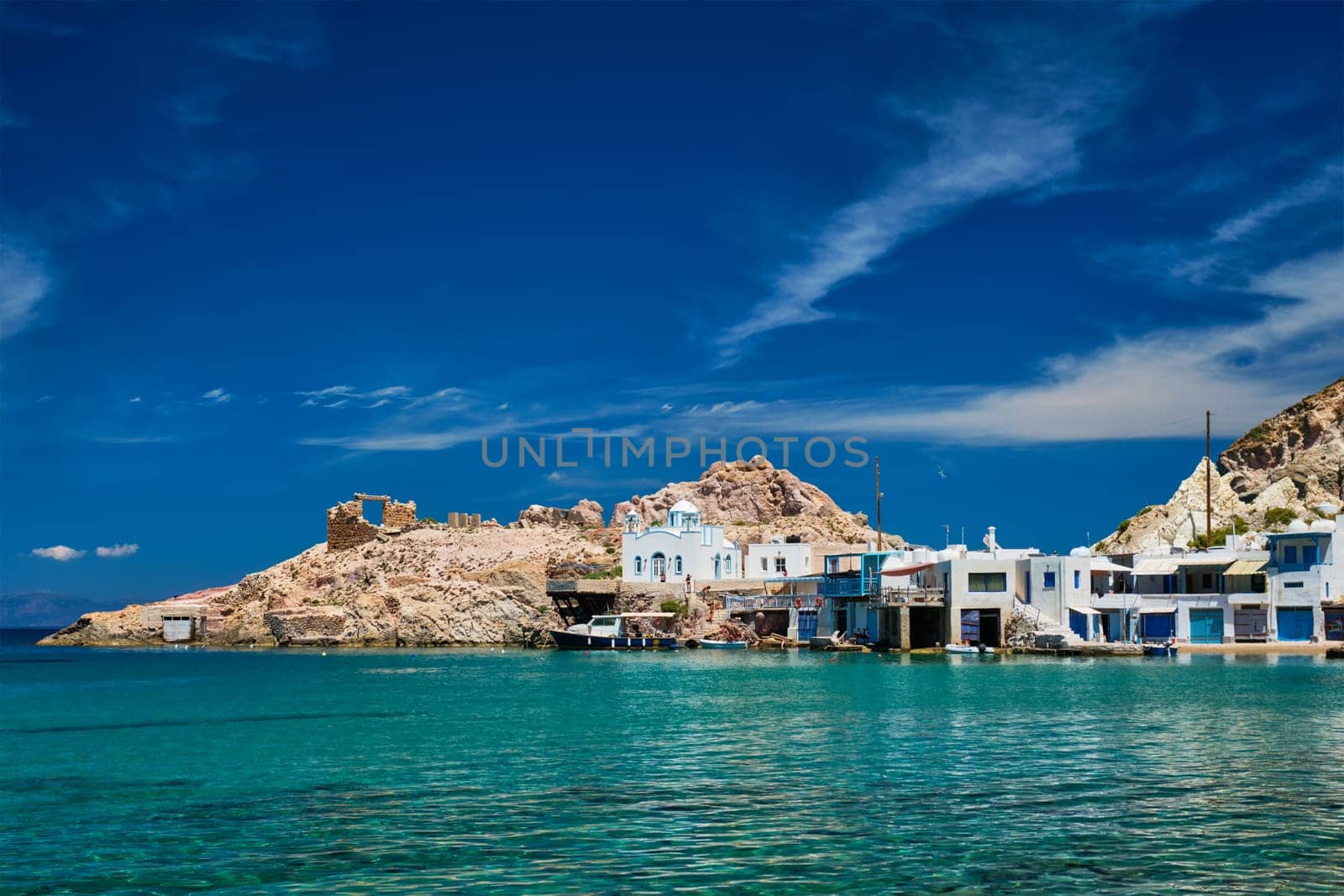 Greek village scenic picturesque view in Greece - the beach and fishing village of Firapotamos in Milos island, Greece