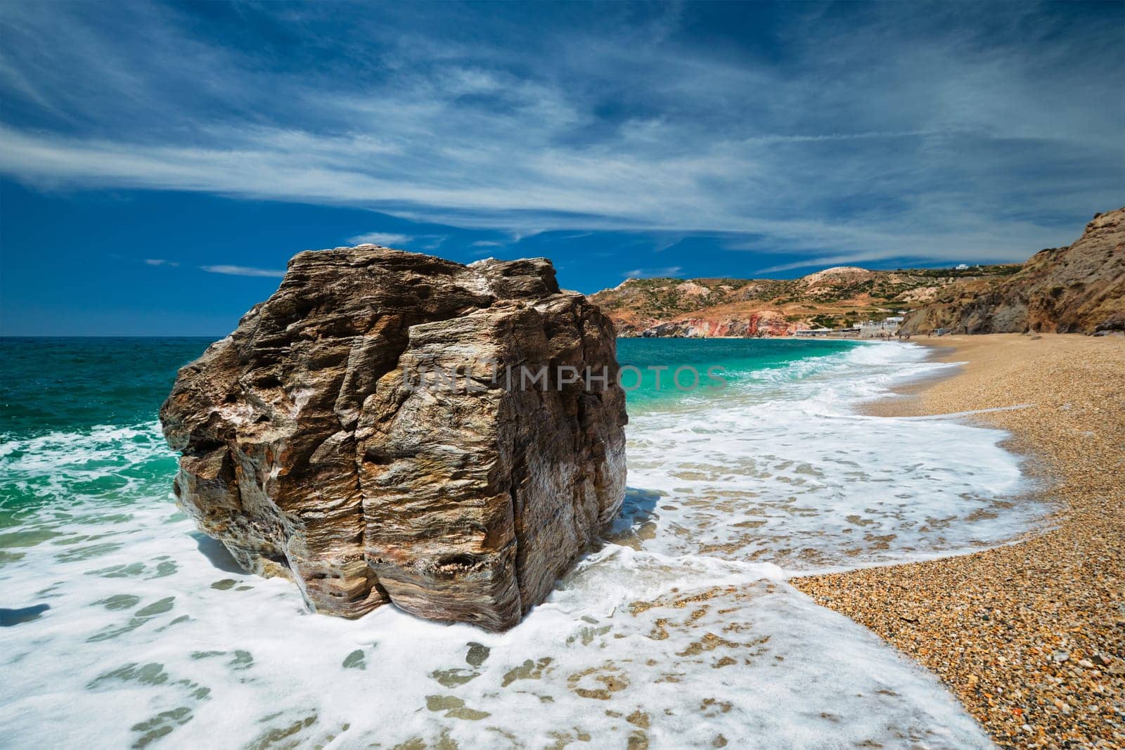 Rocks on Paleochori beach and waves of Aegean sea, Milos island, Cyclades, Greece. Slow motion