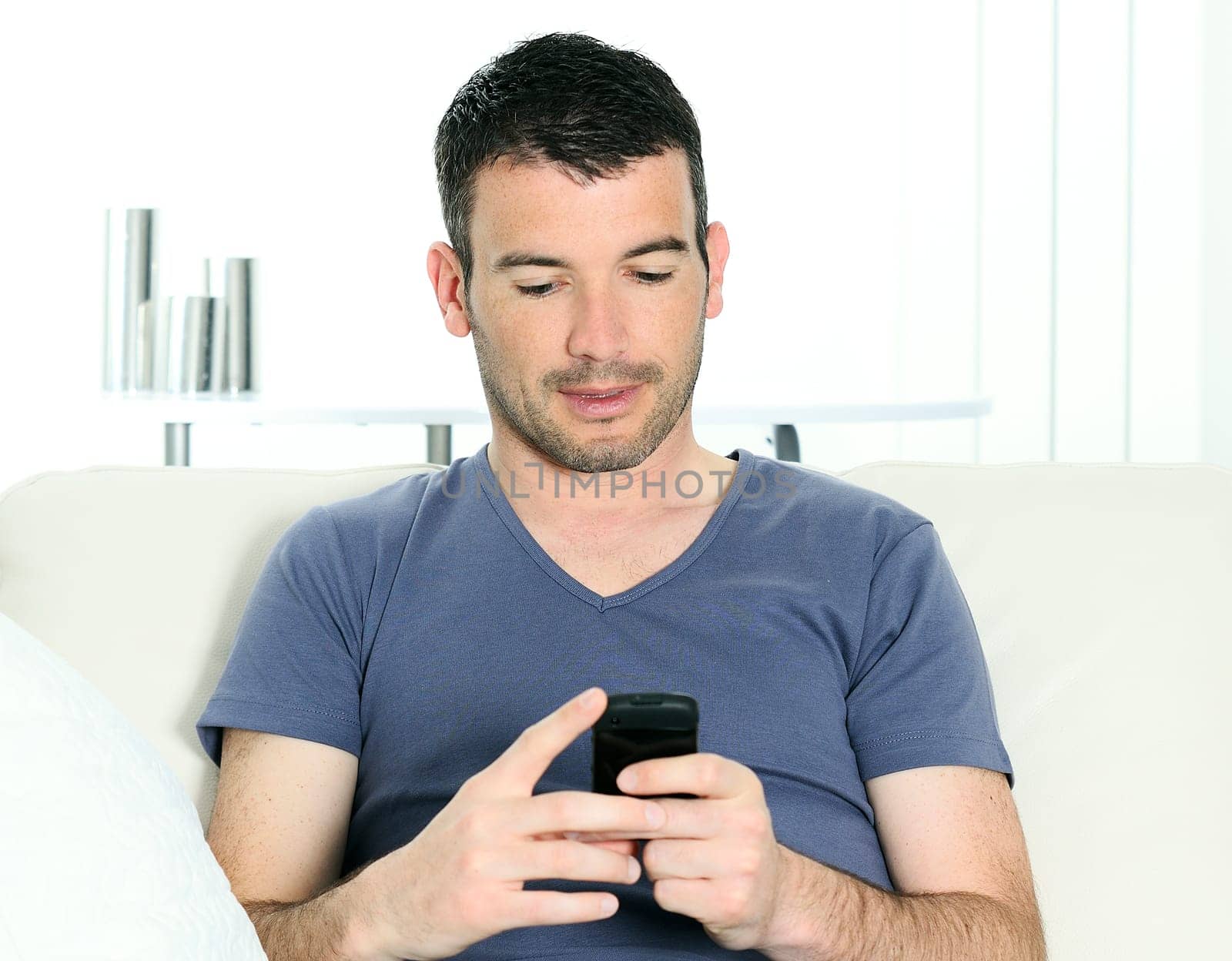 relaxed man with having a communication with a cellephone