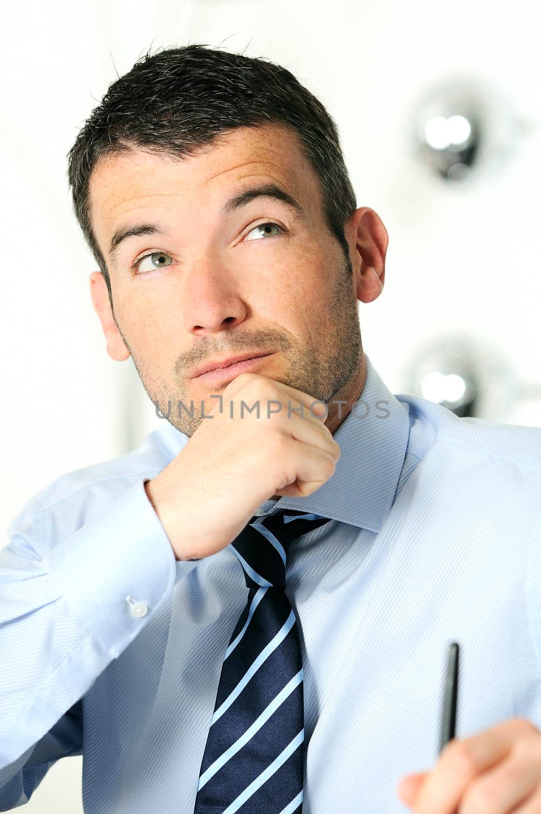 busy man hiding behind a stack of files