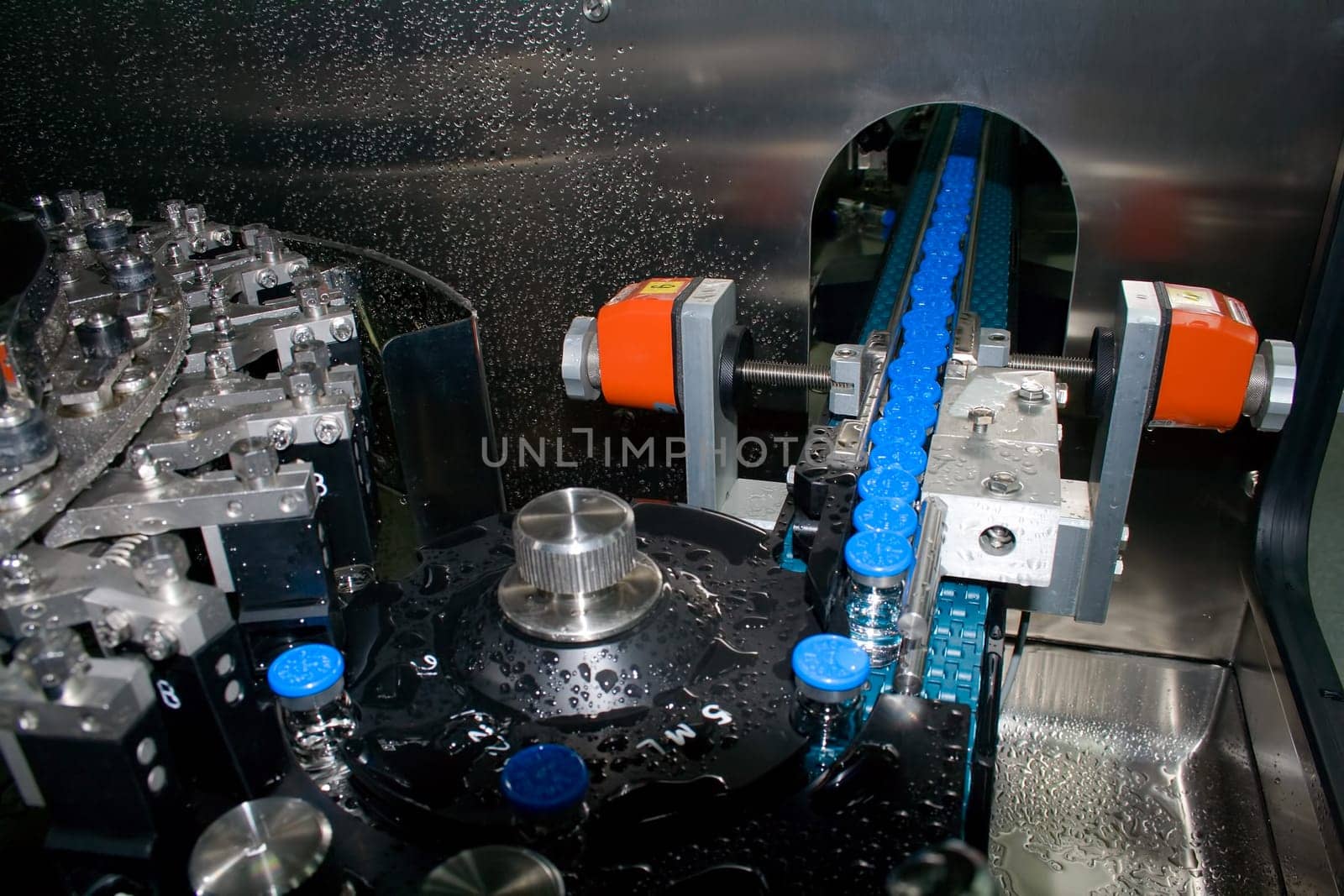 Part of a machine washing bottles at the factory for the production of medicines