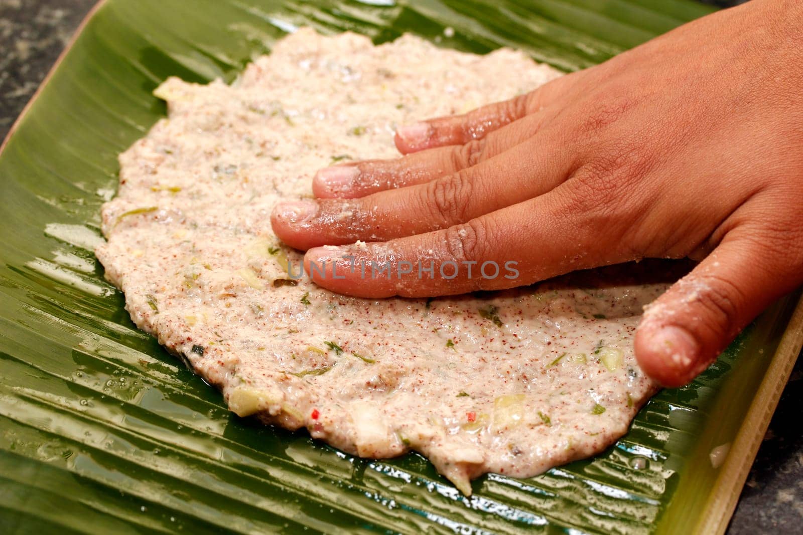 Making process of indian bread on a plantain leaf