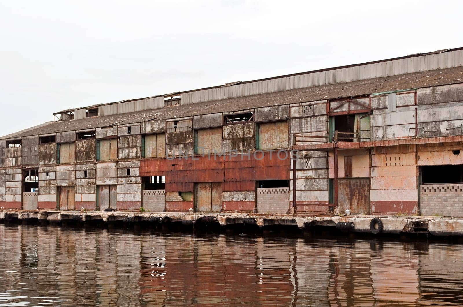 Exterior of an abandoned old rusty industrial building.