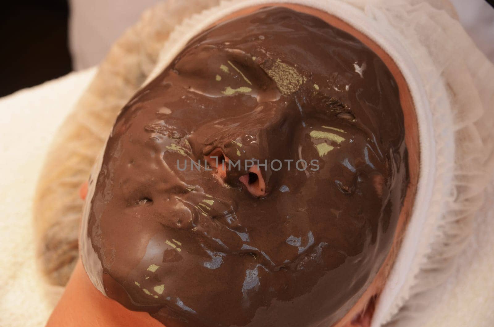 Closeup of Chocolate mask at woman face
