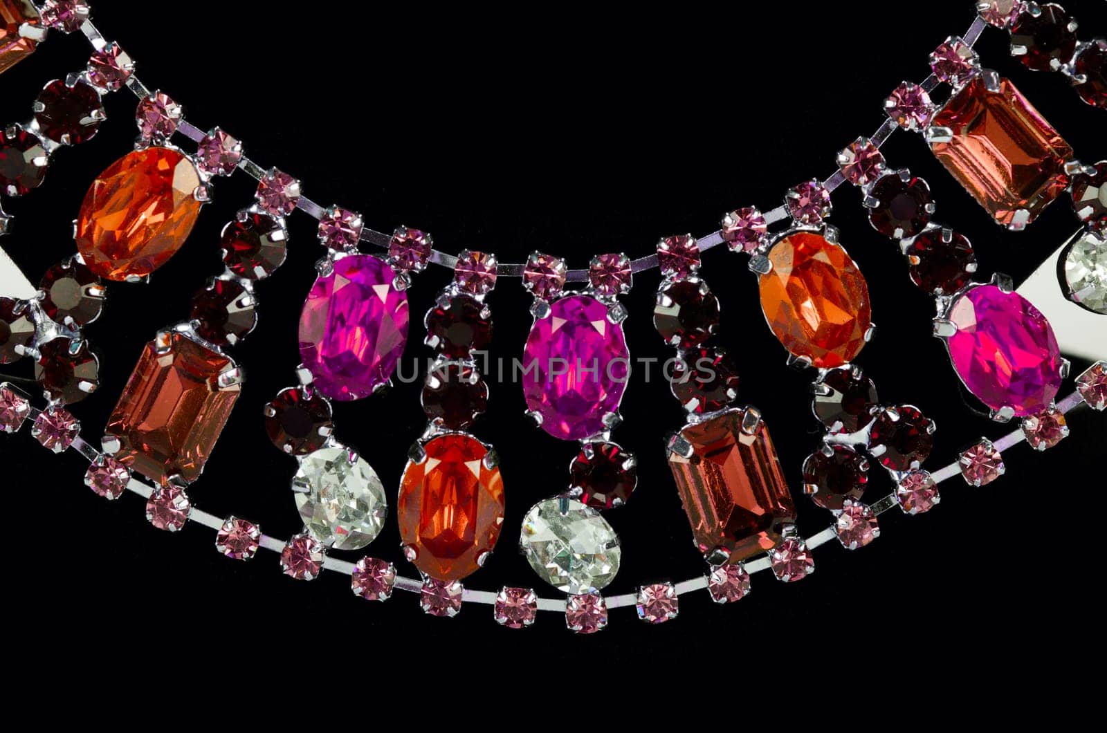 pendant closeup with big gem at black background