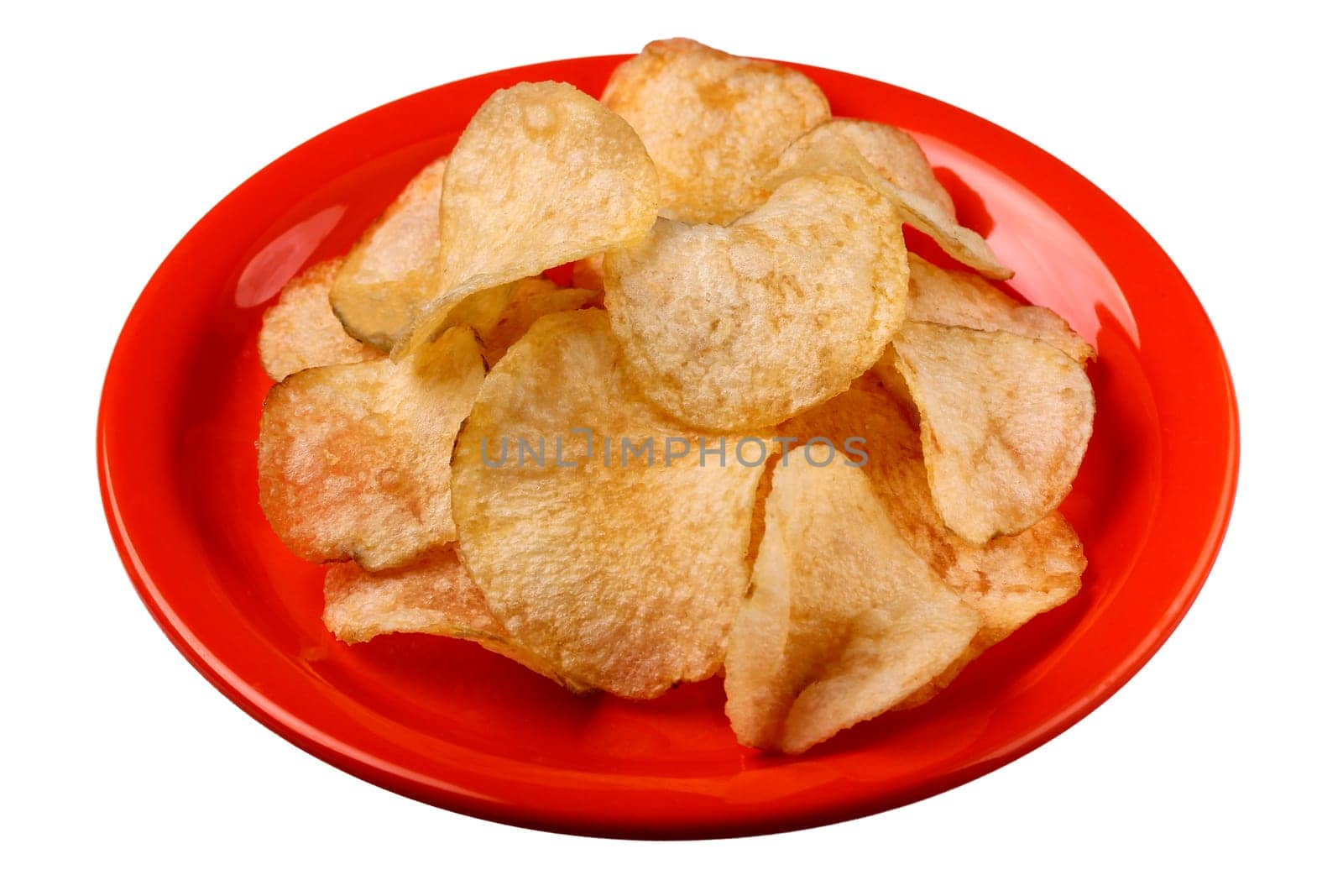 Deep fried salted potato crisps on a plate isolated with clipping path