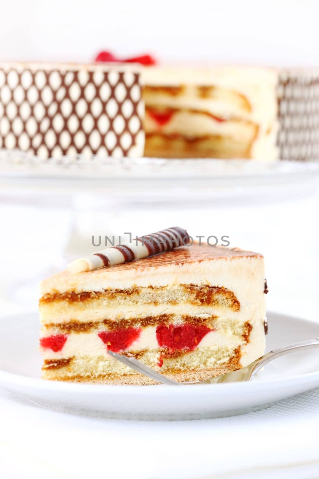 Delicious Tiramisu birthday cake with cherries