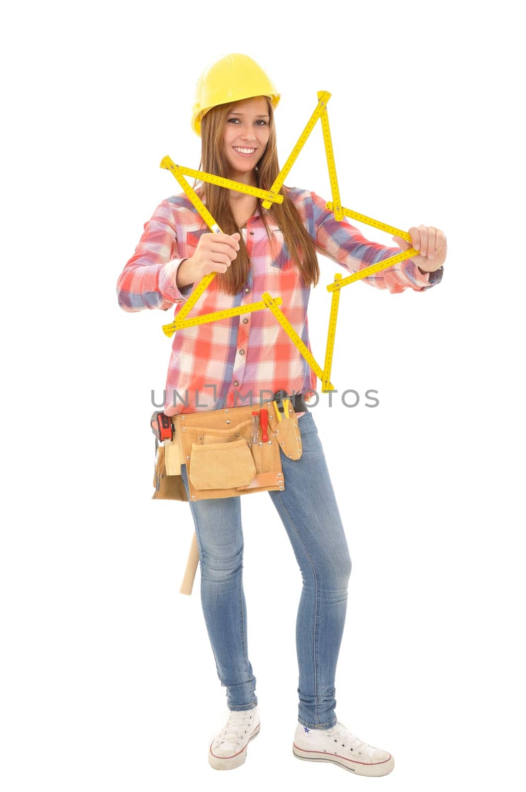 Young craftswoman tinkreing a star from a yellow ruler