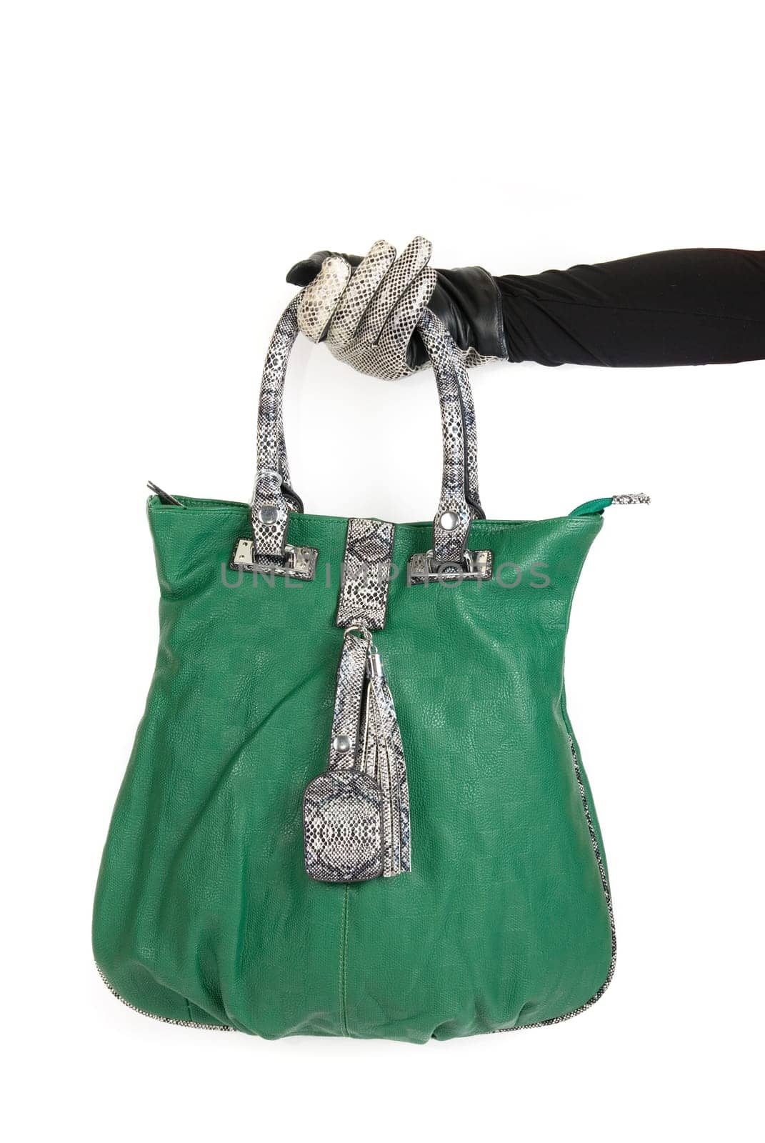 green women bag at hand isolated on white background