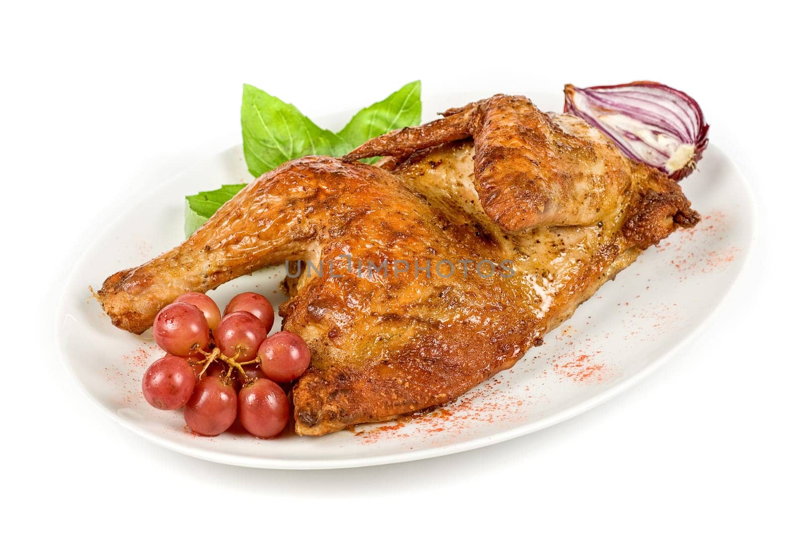 Half roasted chicken with grape on a white