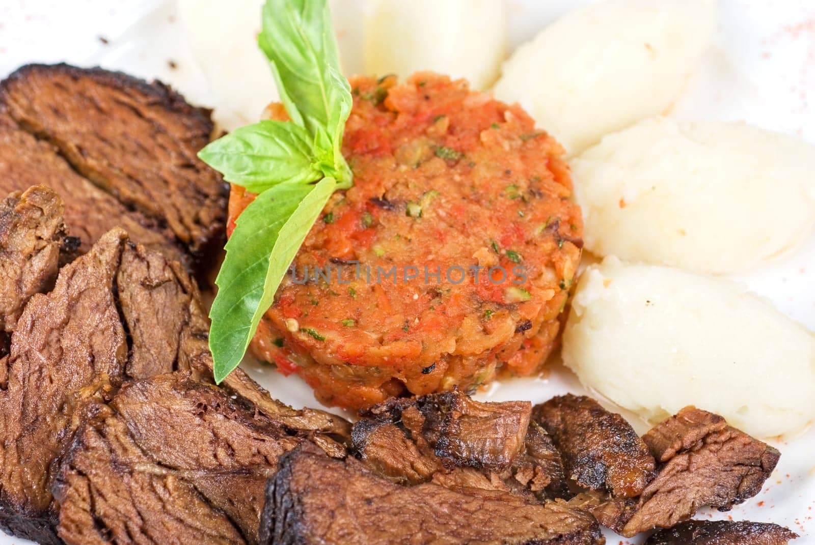 delicate beef fillet roasted with herbs - thyme, rosemary,clary, with potato and vegetable paste