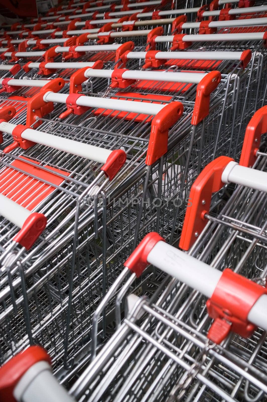 Shopping trolleys pushed inside each other in several rows