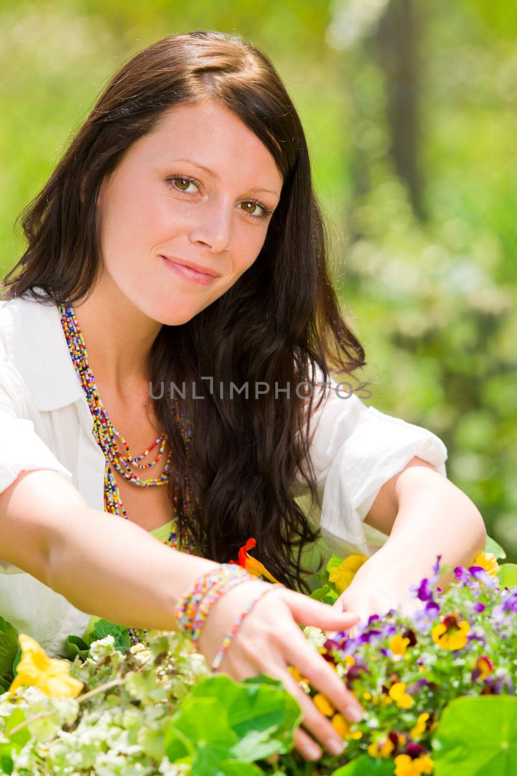 Summer garden beautiful young woman smiling flowers