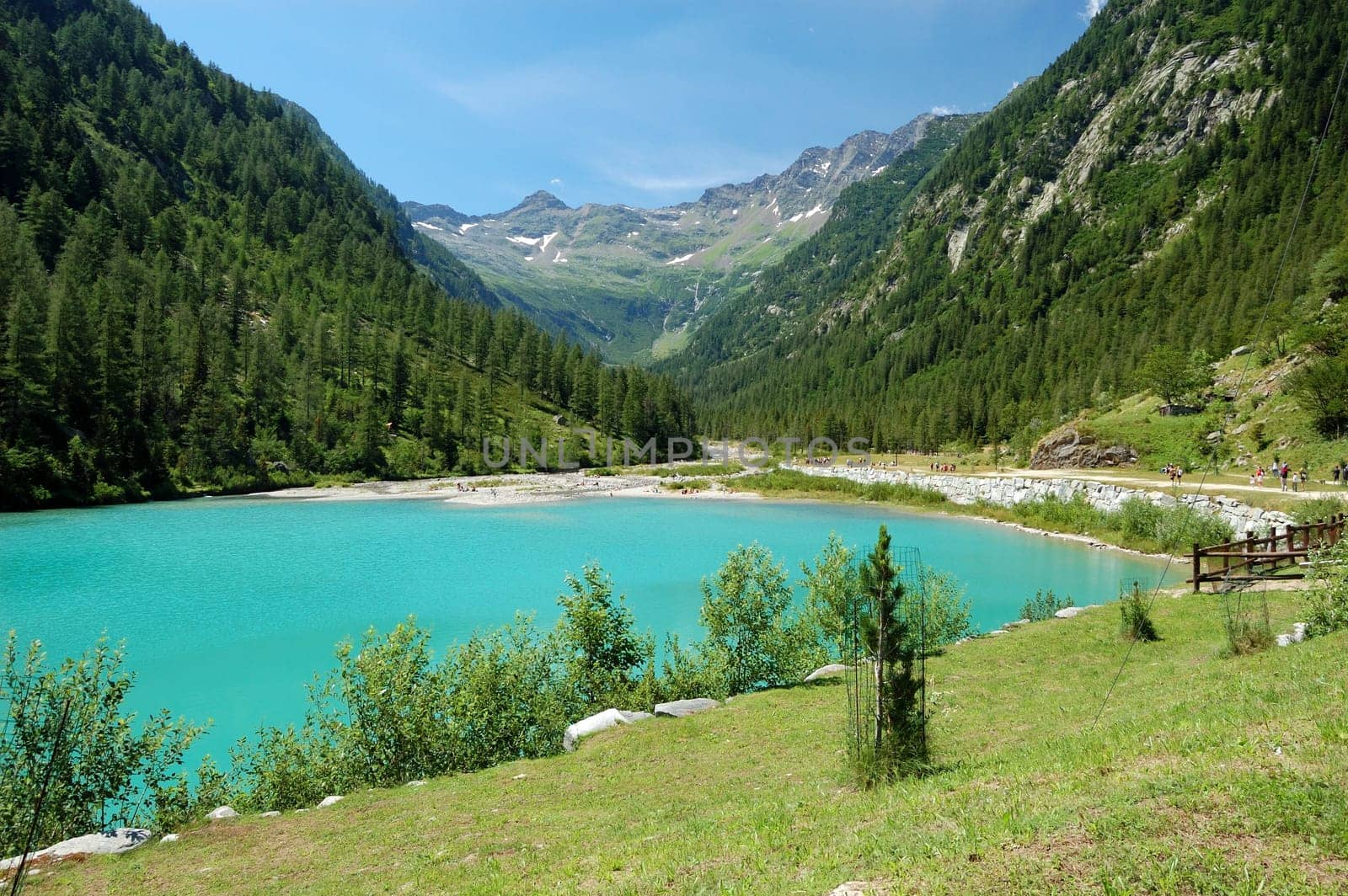 summer Alpine mountain lake landscape, blue sky, Val Quarazza, Italy