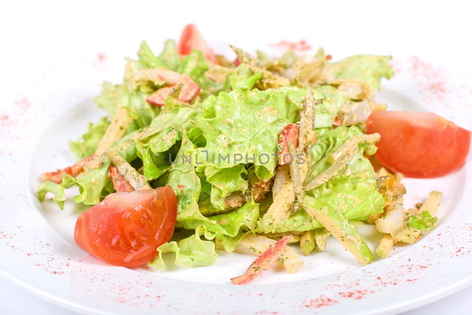 Salad of squid with roast chicken meat, apples, tomatoes, eggs and peppers