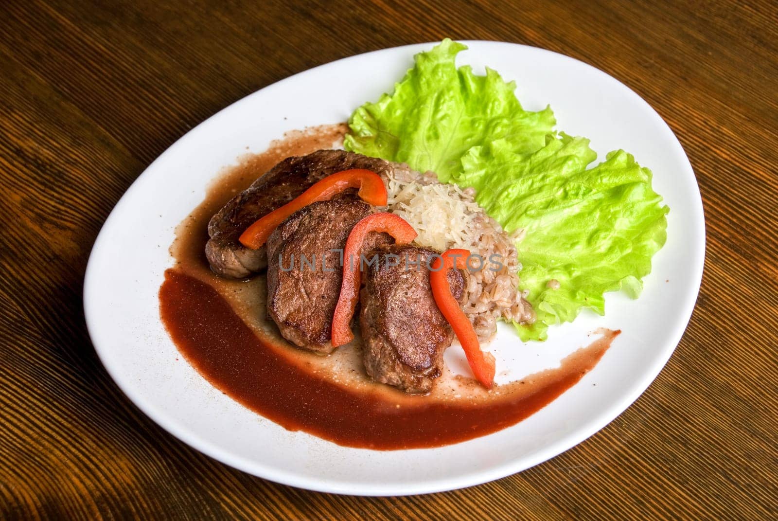 Roast maral meat with blood and garnish pearl barley - very tasty dish
