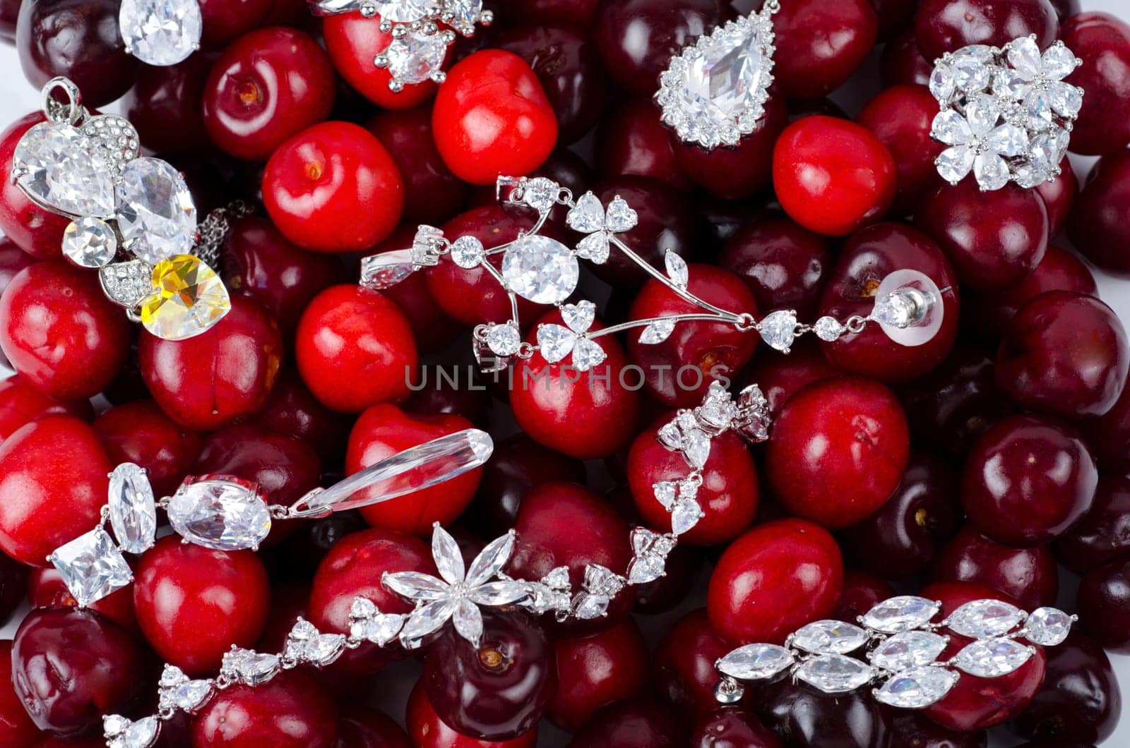 Jewels at fruit red ripe cherries berry background
