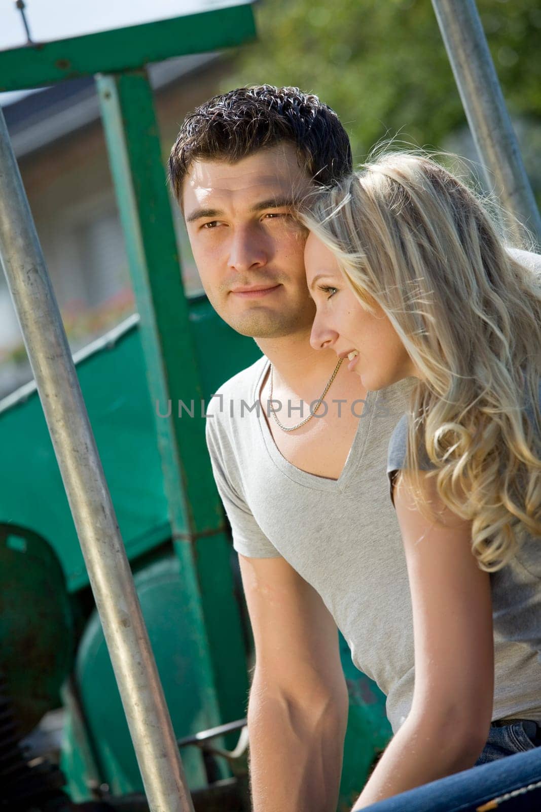Woman cuddling with her boyfriend in countryside