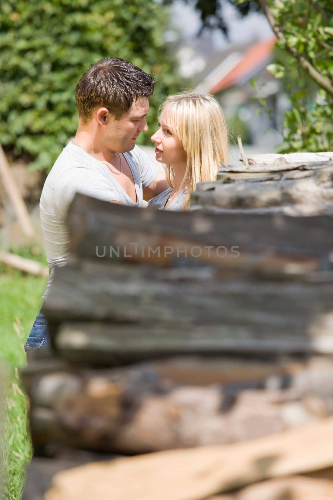 young romantic couple embracing in countryside