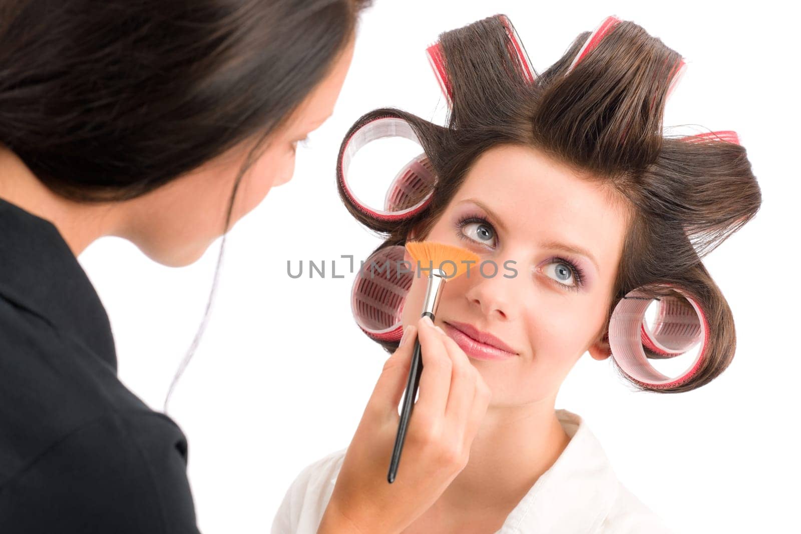 Make-up artist woman fashion model apply powder blush rouge brush