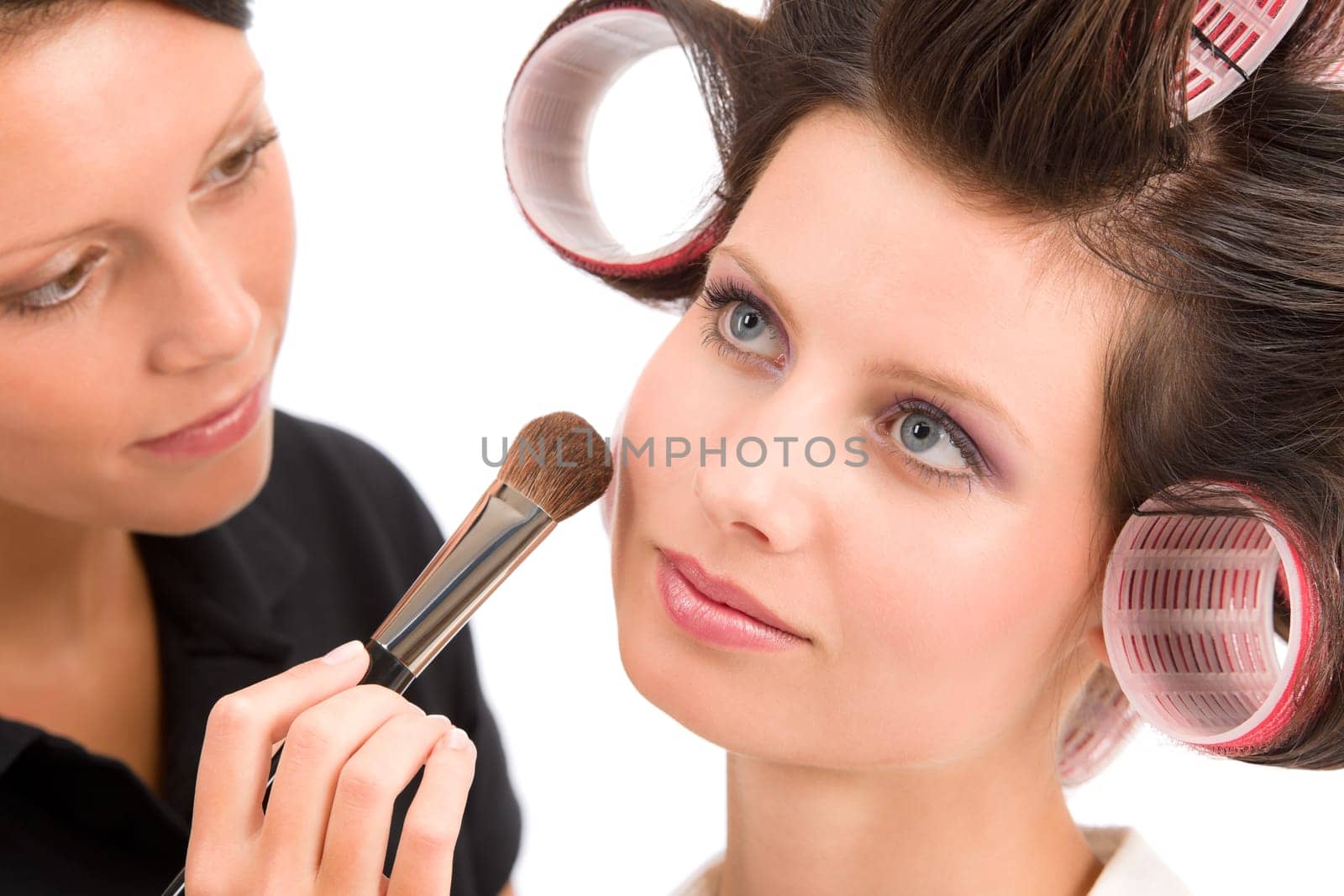 Make-up artist woman fashion model apply powder blush rouge brush