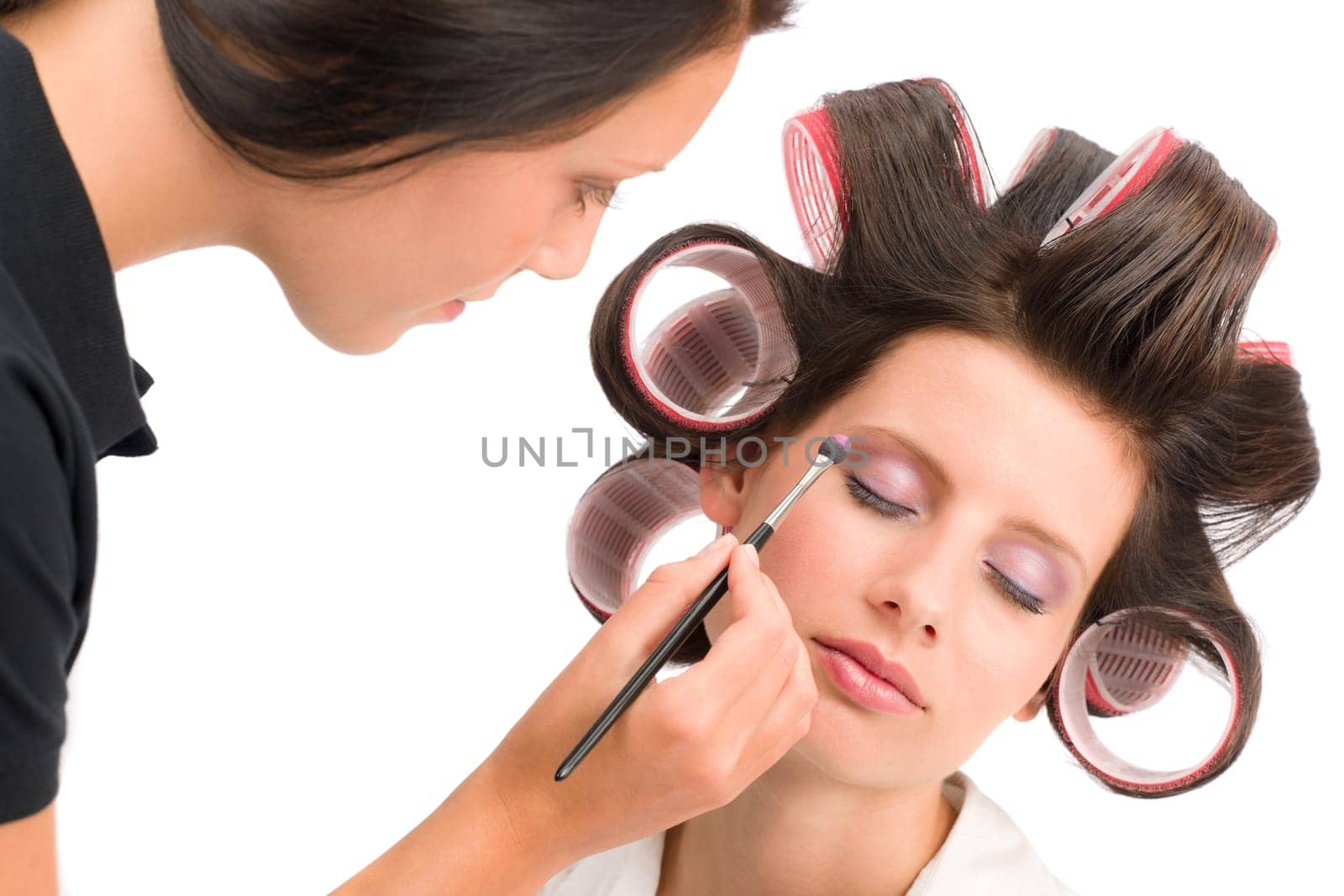Make-up artist woman fashion model apply eyeshadow with brush