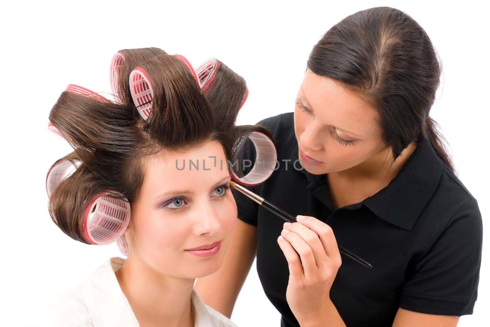 Make-up artist woman fashion model apply eyeshadow with brush