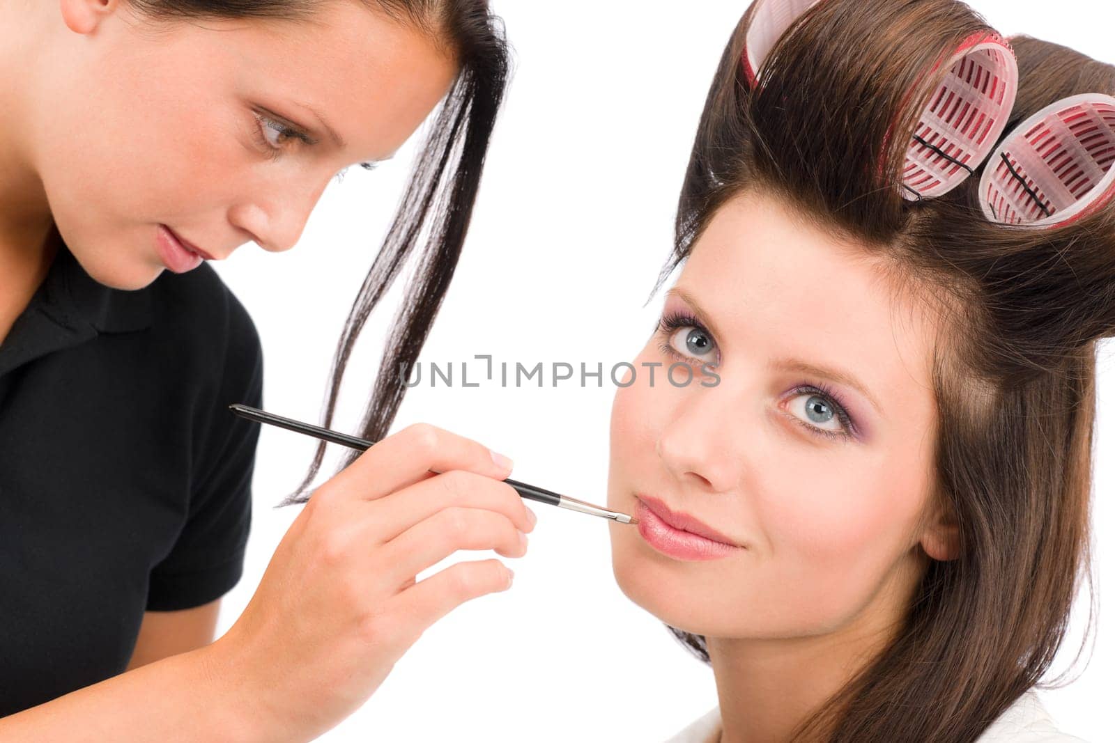 Make-up artist beautiful woman fashion model apply lipstick