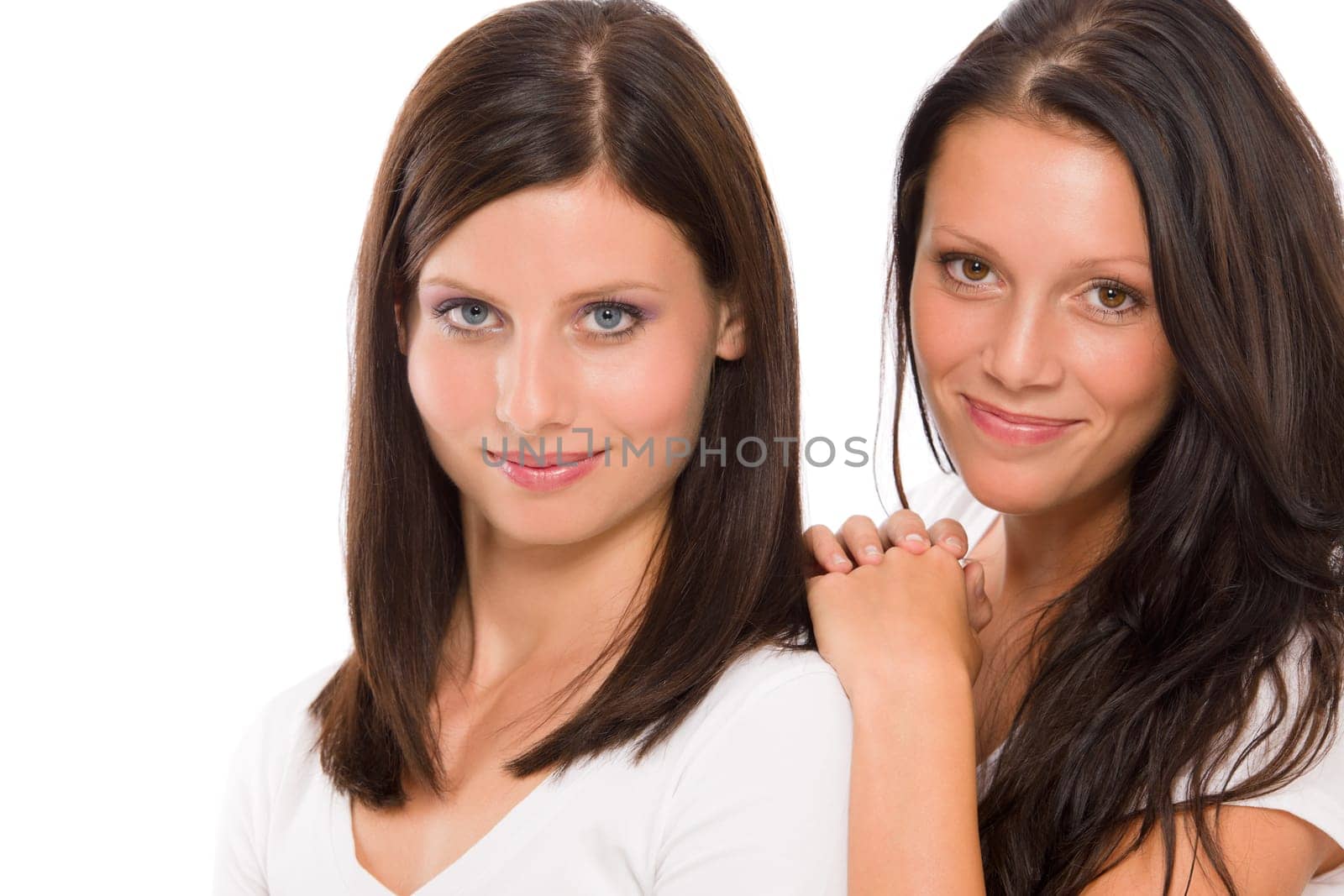 Two cheerful girlfriends beautiful face brunette model smiling natural portrait